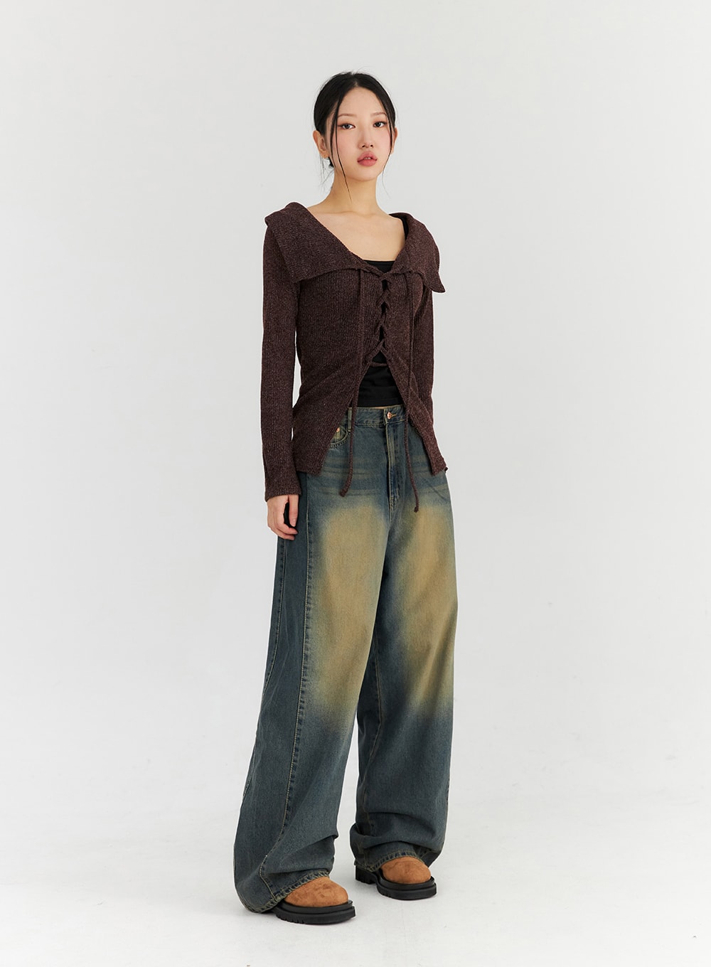 Washed Wide Leg Jeans CN315 in dark blue, three-quarter front view on model, street-style wide leg denim with retro yellow fading, worn with brown lace-up knit top.