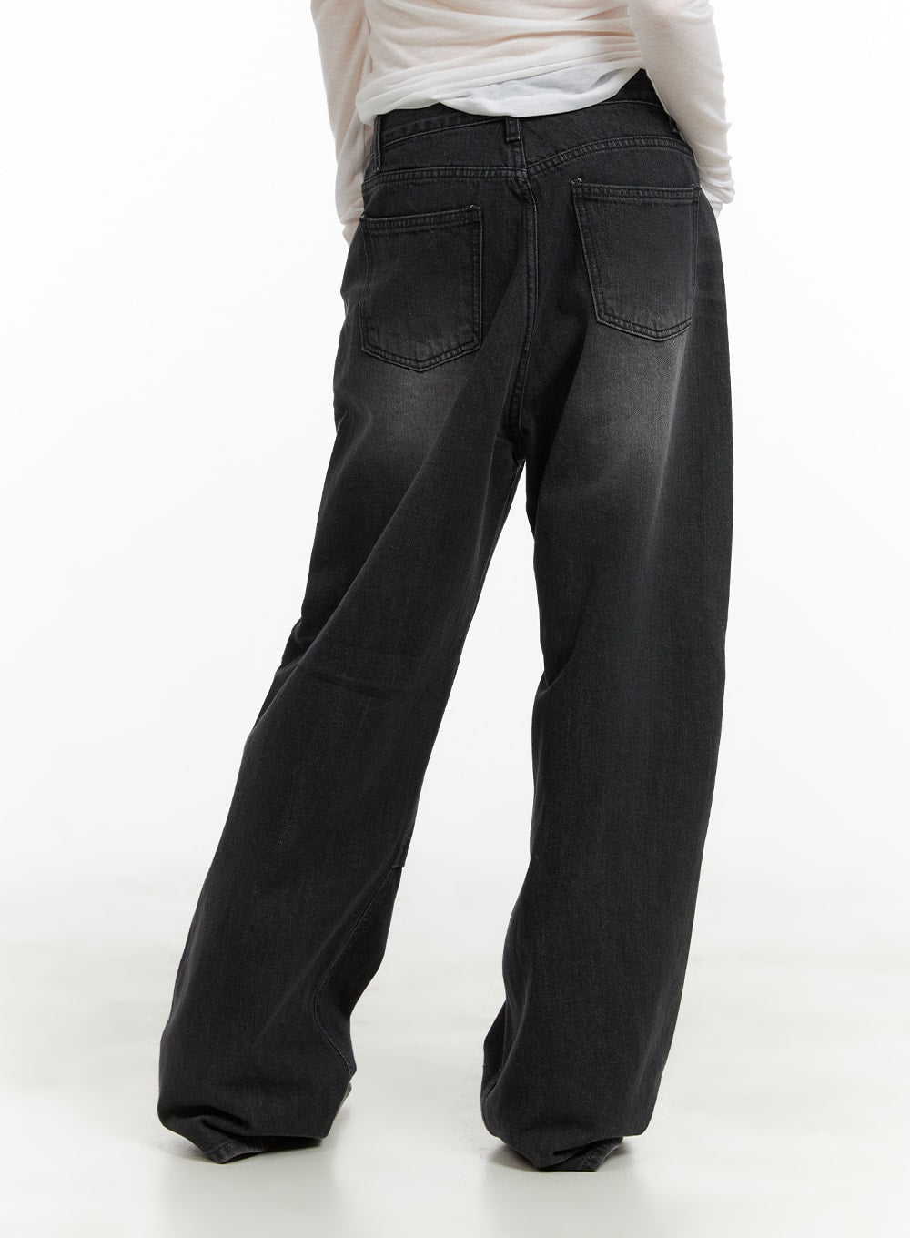 Pintuck Washed Denim Wide Leg Jeans CA419 in black, back view on model, featuring two back patch pockets and washed fade detail on wide-leg cotton denim.