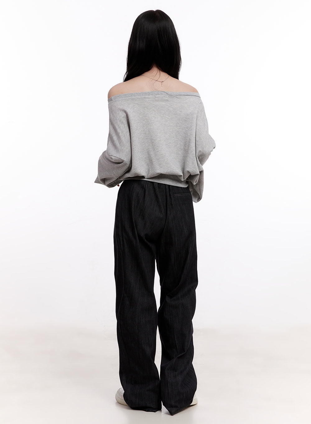 Pintuck Wide-Leg Denim Pants CM527 in black, back full-body on model, wide-leg cotton denim paired with grey off-shoulder top, rear drape and hem detail visible.