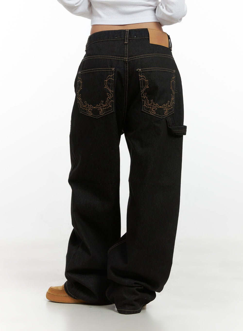 Mara Relaxed Fit Pocketed Cotton Wide Leg Jeans CS426 in black, back full-length view on model, dual embroidered back pockets, carpenter loop detail, wide relaxed leg, tan leather label at waistband.