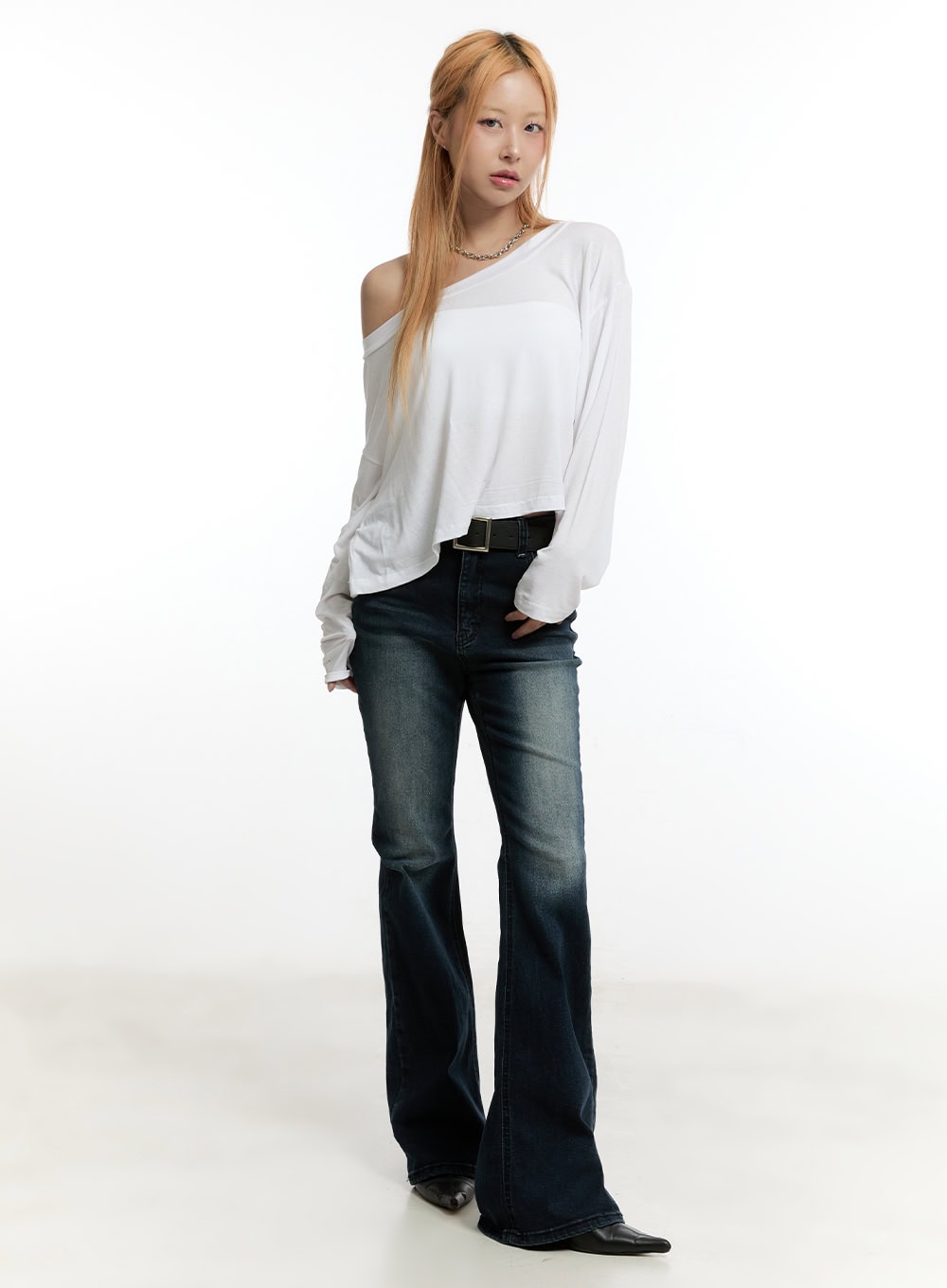 Ruelle Slim Washed Bootcut Jeans CY501 in dark blue, full front view on model, slim fit with bootcut flare, worn with black belt and white off-shoulder long sleeve top and black boots.
