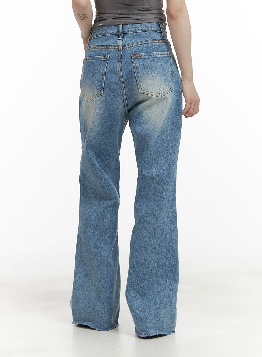 Denim Stitching Wide Fit Straight Jeans CA402 in blue, back full-length shot on model, showing wide straight silhouette, washed denim, dual back pockets, and raw-cut hem at ankle.