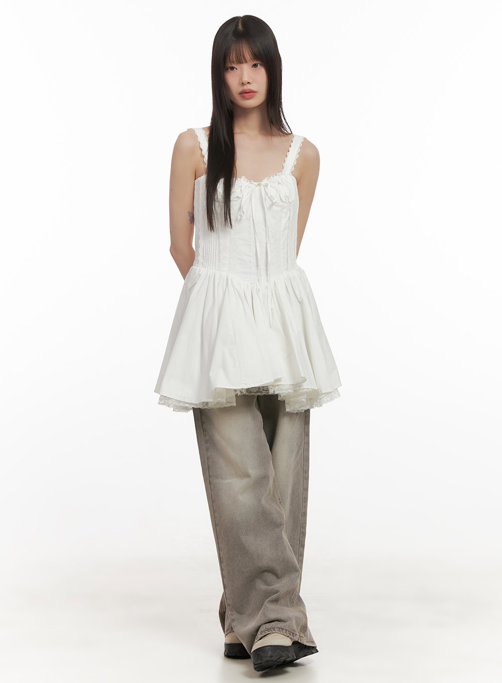 Hollie Vintage Wide-Leg Jeans CD426 in gray, front full-length shot on model, wide baggy washed denim with front whiskering, styled with white lace-hem peplum cami and chunky shoes.