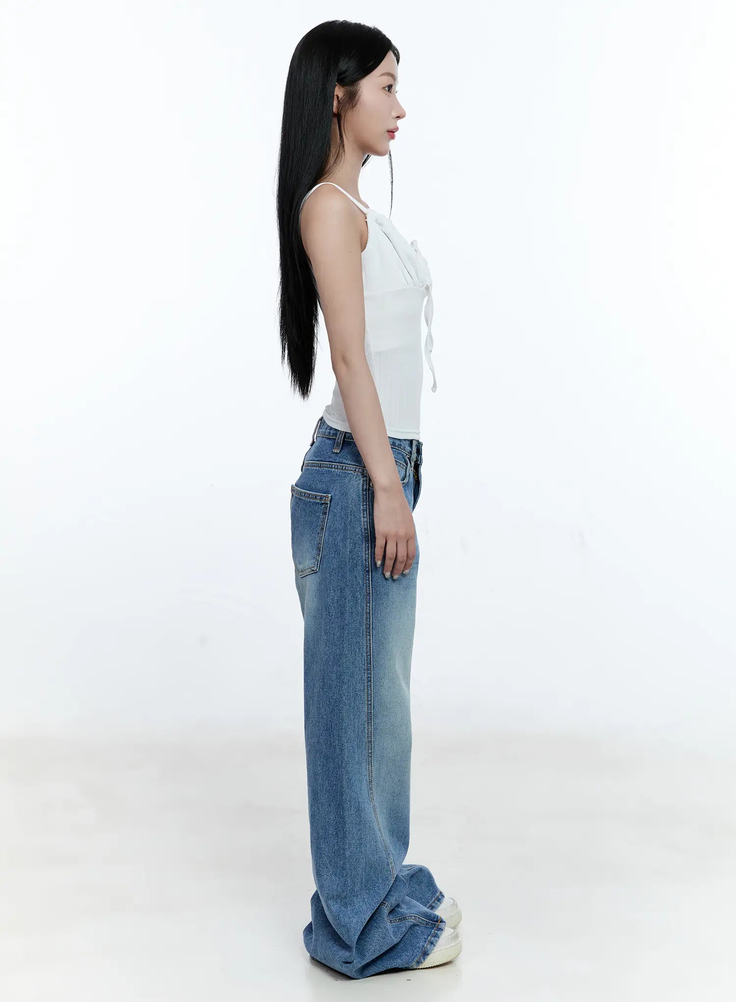 Ana Wide-Leg Denim Jeans CG507 in blue, full-length side view on model, washed wide-fit denim with white cami top, showing high waist and floor-length wide leg hem.