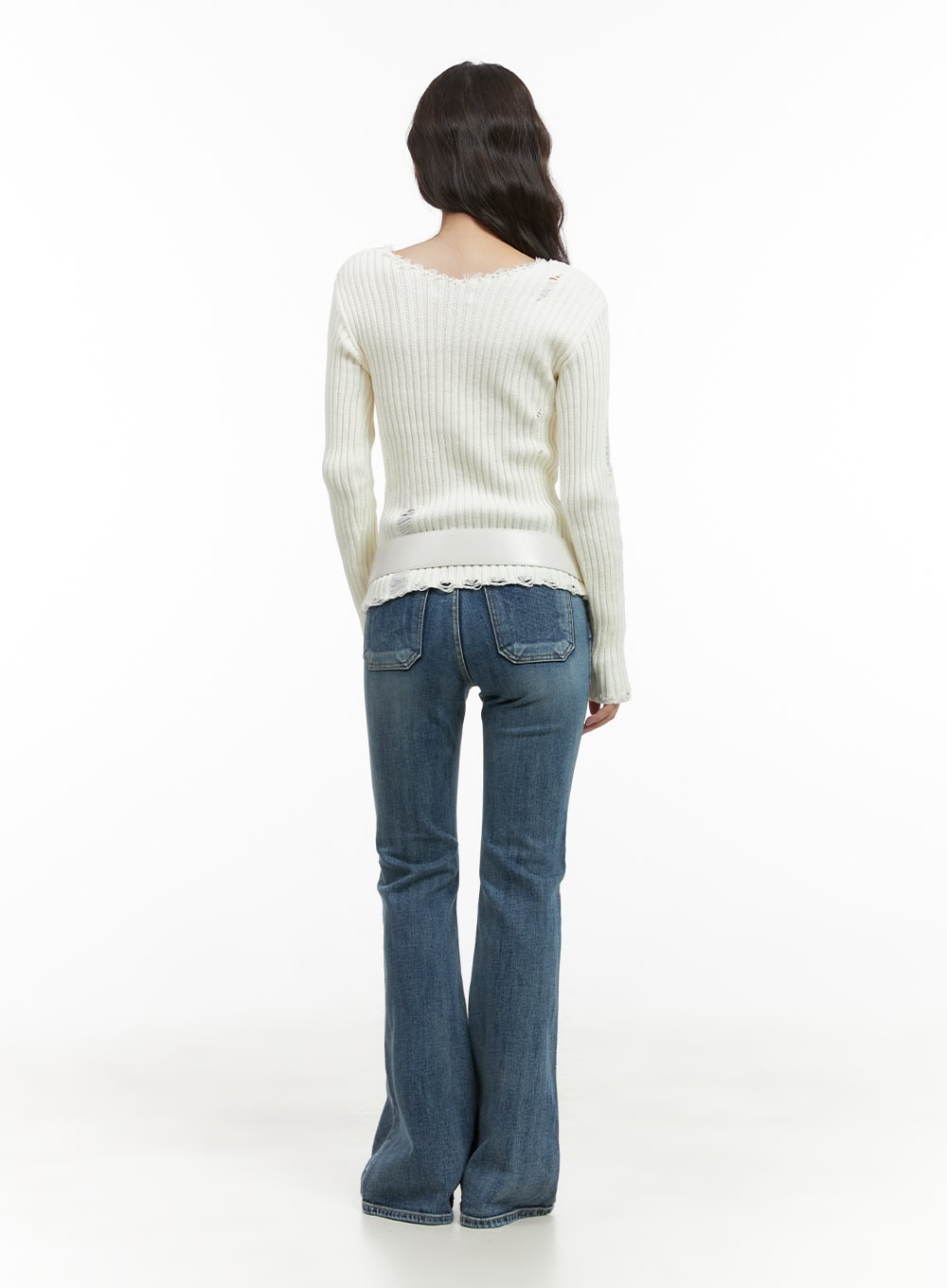 Lila Slim Bootcut Jeans CG422 in blue, full-body back shot on model, slim fit washed denim with bootcut flare and back patch pockets, styled with white distressed ribbed knit top.