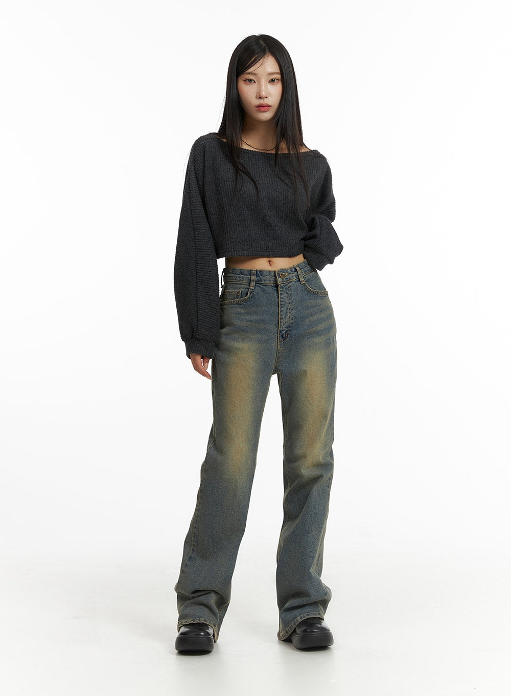 Washed Slim Fit Bootcut Jeans CJ431 in blue, full-length front on model facing camera, grey off-shoulder crop knit top, warm yellow washed denim with slim fit through hips and bootcut leg opening.