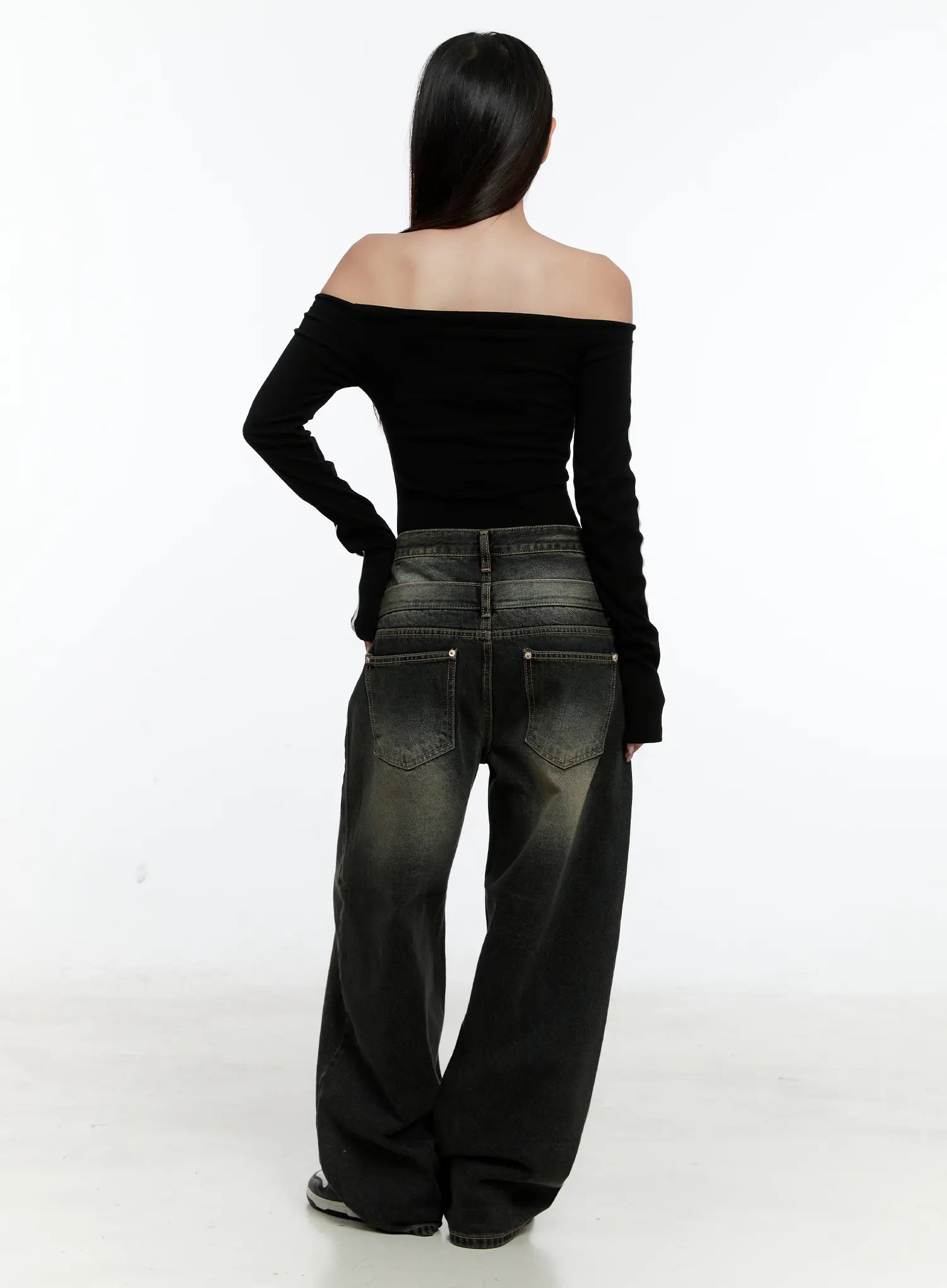 Emerie Washed Wide-Leg Baggy Jeans CS518 in dark blue, back full-body view on model, showing back pockets and floor-grazing wide leg with yellow-toned washed cotton denim, paired with black top.