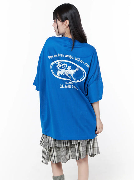Oversized Mesh Graphic Tee CU519 in Blue M/L, back close-up on model, mesh texture clearly visible, white lion and K.I.M.M TEAM 1994 back graphic print, semi-sheer mesh fabric detail.