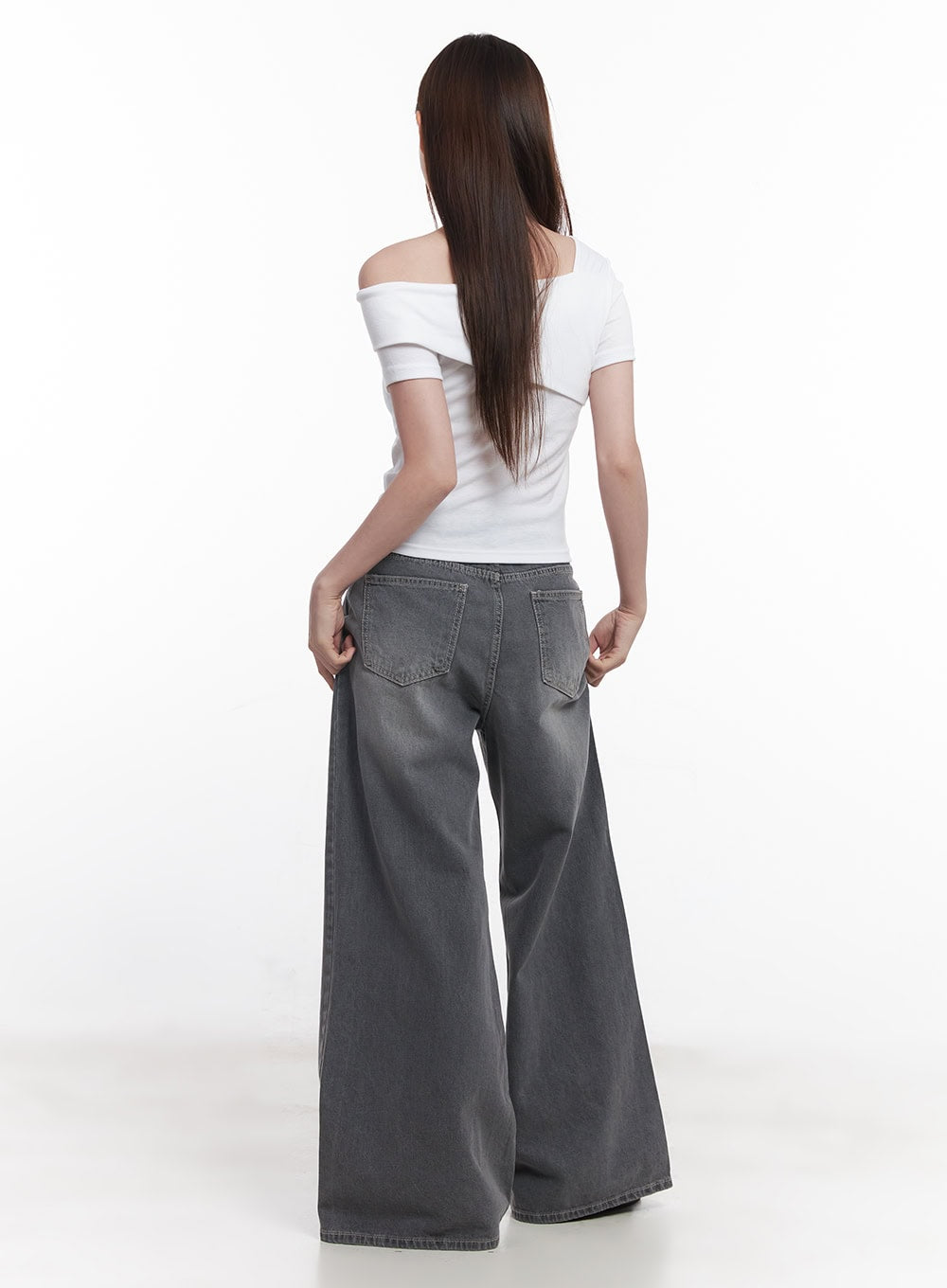 Beatriz Washed Wide-Leg Jeans CY519 in gray, full-body back shot on model, back pocket detail visible, extremely wide leg hem, styled with white off-shoulder top.