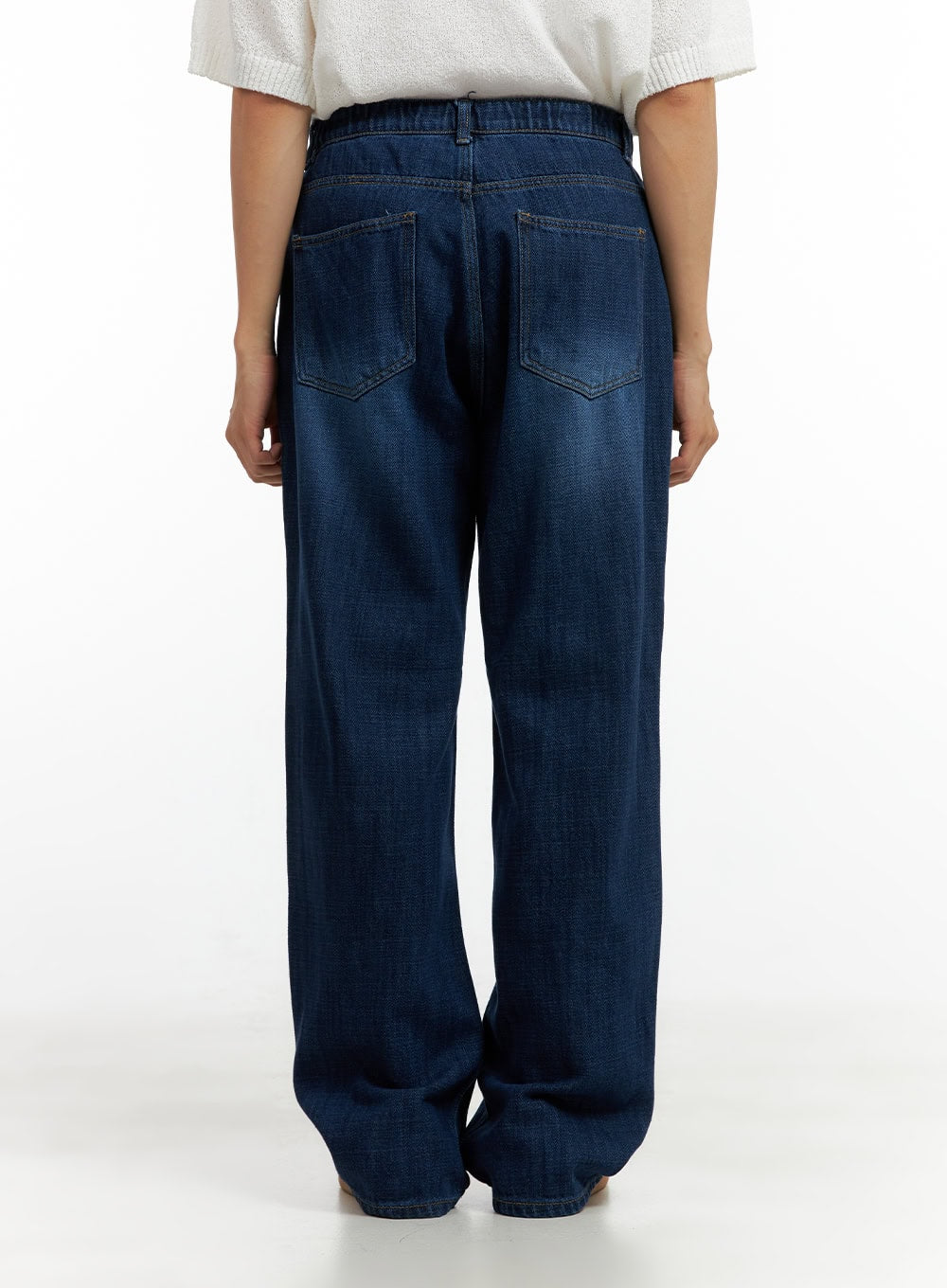 Men's Washed Cotton Denim Jeans CL429 in dark blue, back view on model, wide-leg fit, two back pockets with bar-tack stitching, elastic waistband detail, washed cotton denim.