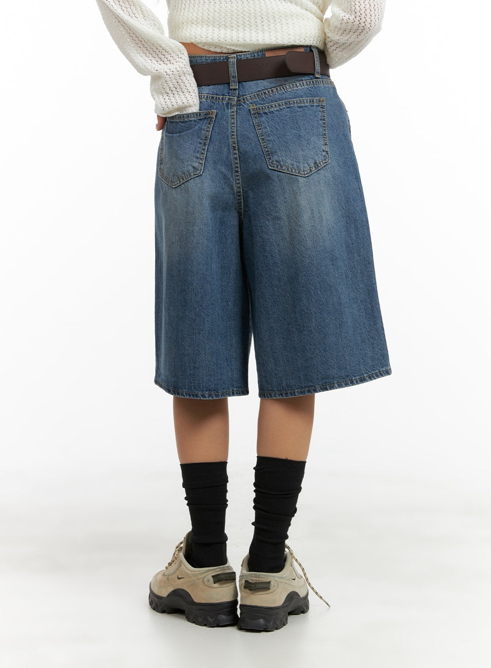 Vintage Washed Wide Leg Jorts CA415 in blue, full back view on model, wide-leg knee-length denim jorts with dual back pockets and vintage wash, paired with white knit and chunky sneakers.