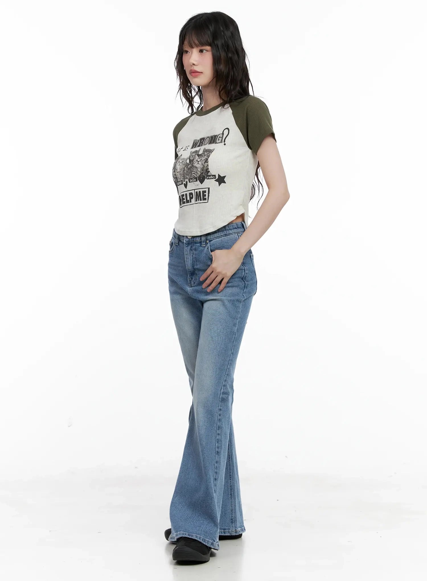 Hikaru High-Waist Flare Jeans IL531 in blue, 3/4 side view on model, washed denim flare hem grazing floor, high-waist fit, styled with cropped olive raglan tee.
