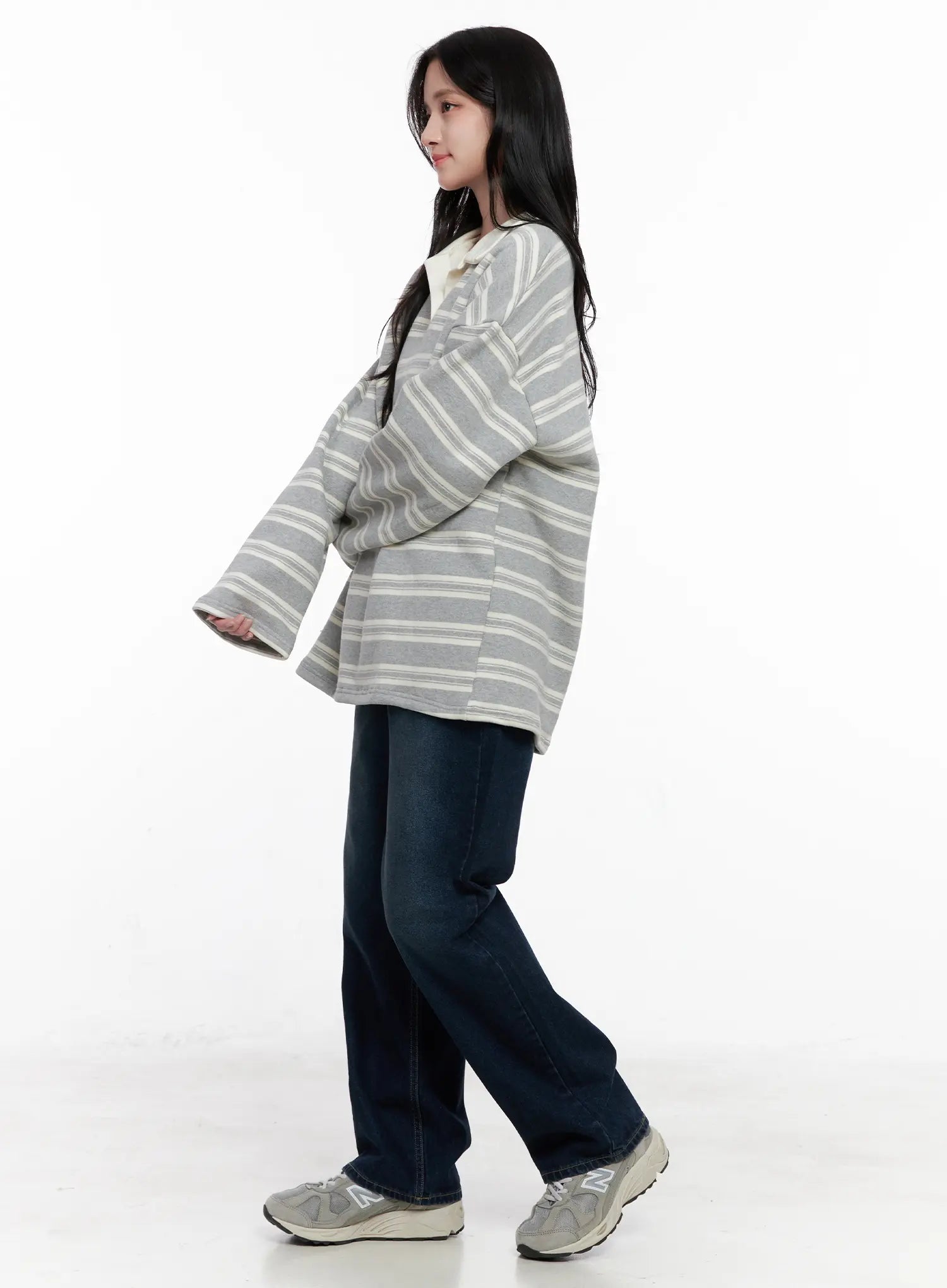 Shiloh Washed Semi-Wide Jeans CO524 in dark blue, three-quarter side styling shot on model, wide-leg silhouette shown in motion with striped oversized polo top.