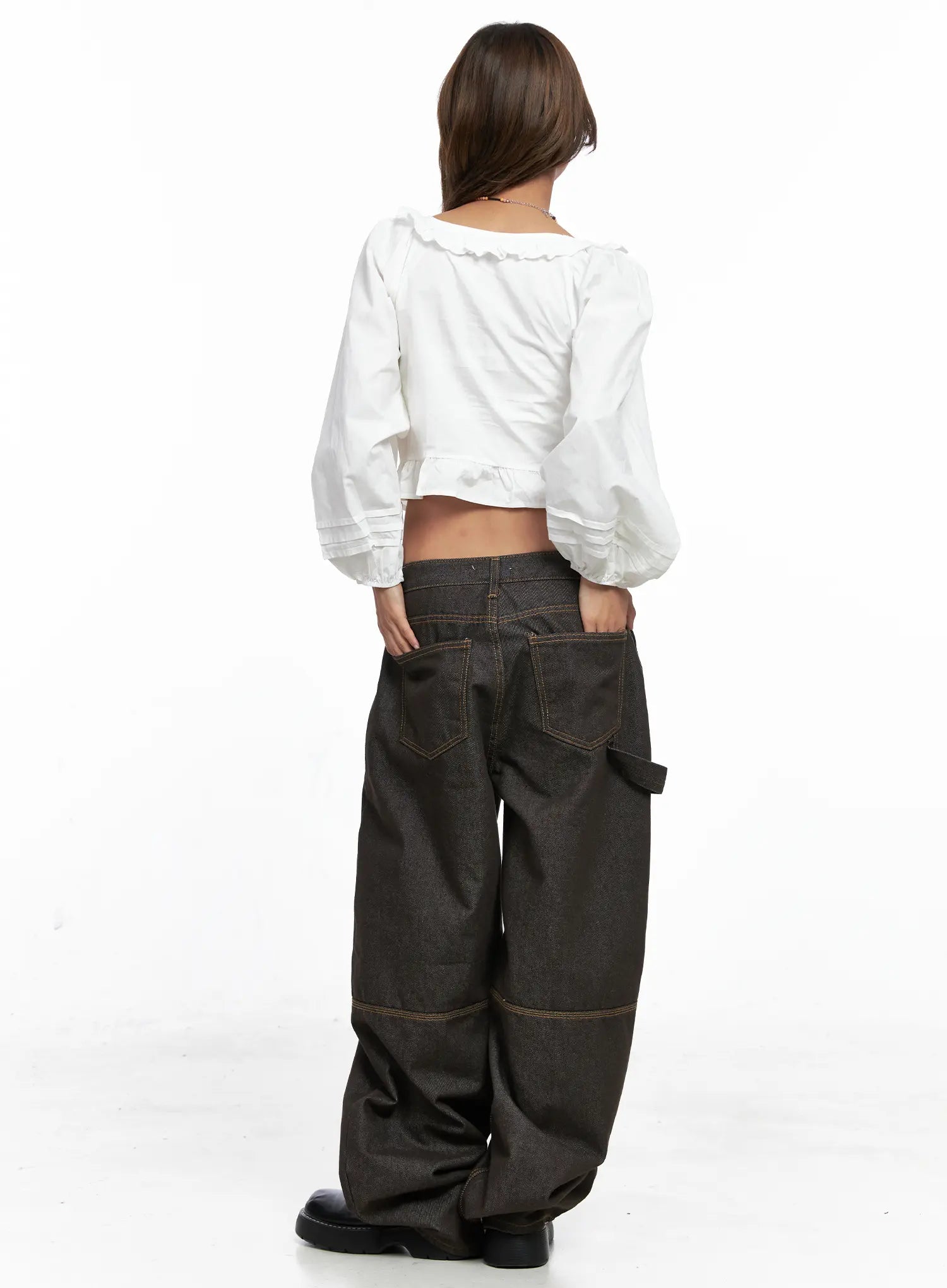 Oaklyn Non-Fade Wide-Leg Jeans CO513 in dark brown, back full-body view on model wearing white ruffle crop top, showing back pockets with contrast stitching and voluminous wide hem.