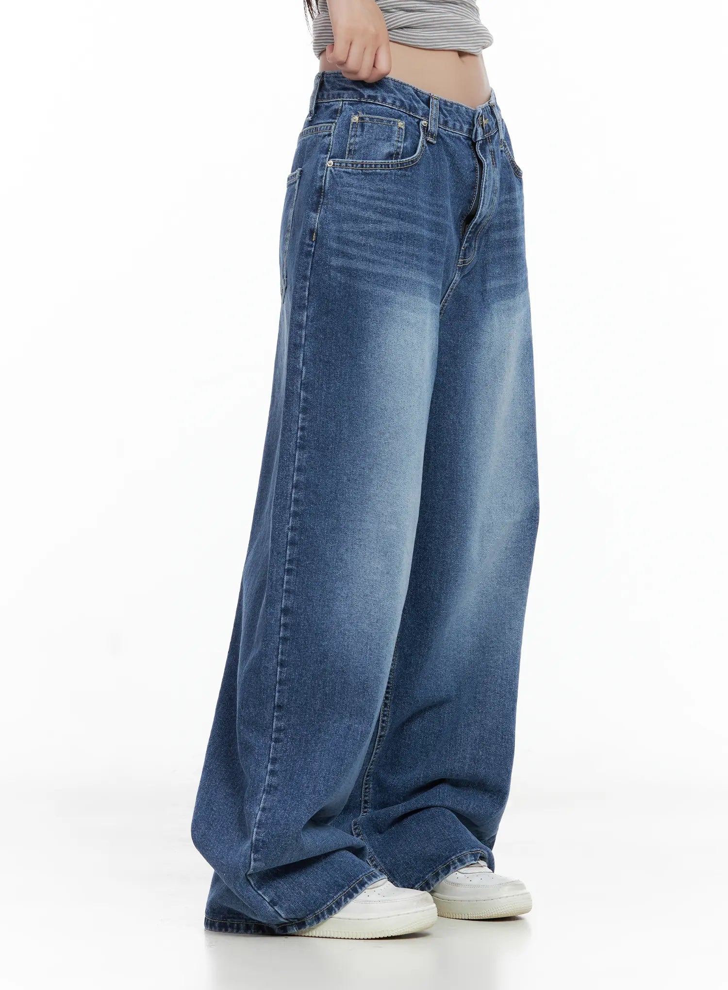 Hayoung Washed Wide-Leg Denim Jeans CL509 in dark blue, side close-up from waist to hem on model, showing mid-rise waistband, side seam, and faded washed gradient on wide-leg cotton denim.