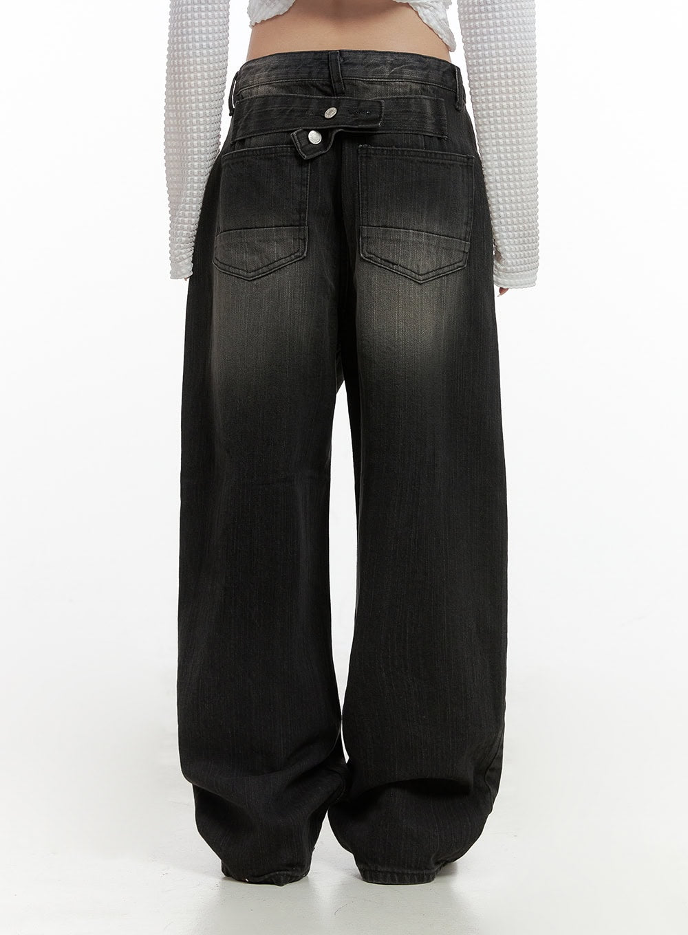 Sage Back-Buttoned Wide Pants CS430 in black, back full view on model, back-buttoned waistband, dual patch pockets with chevron stitching, washed wide-leg denim with faded center panel.