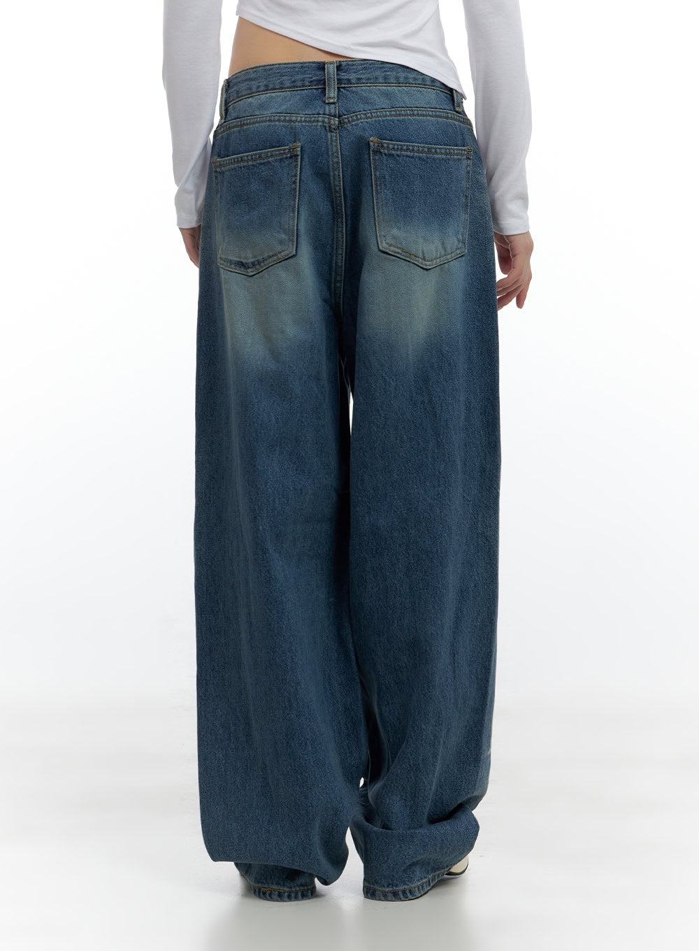 Aria Comfy Cotton Wide Leg Jeans CS420 in blue, close back view on model, back yoke and dual patch pockets highlighted, washed denim surface with vintage tint, floor-length wide leg.