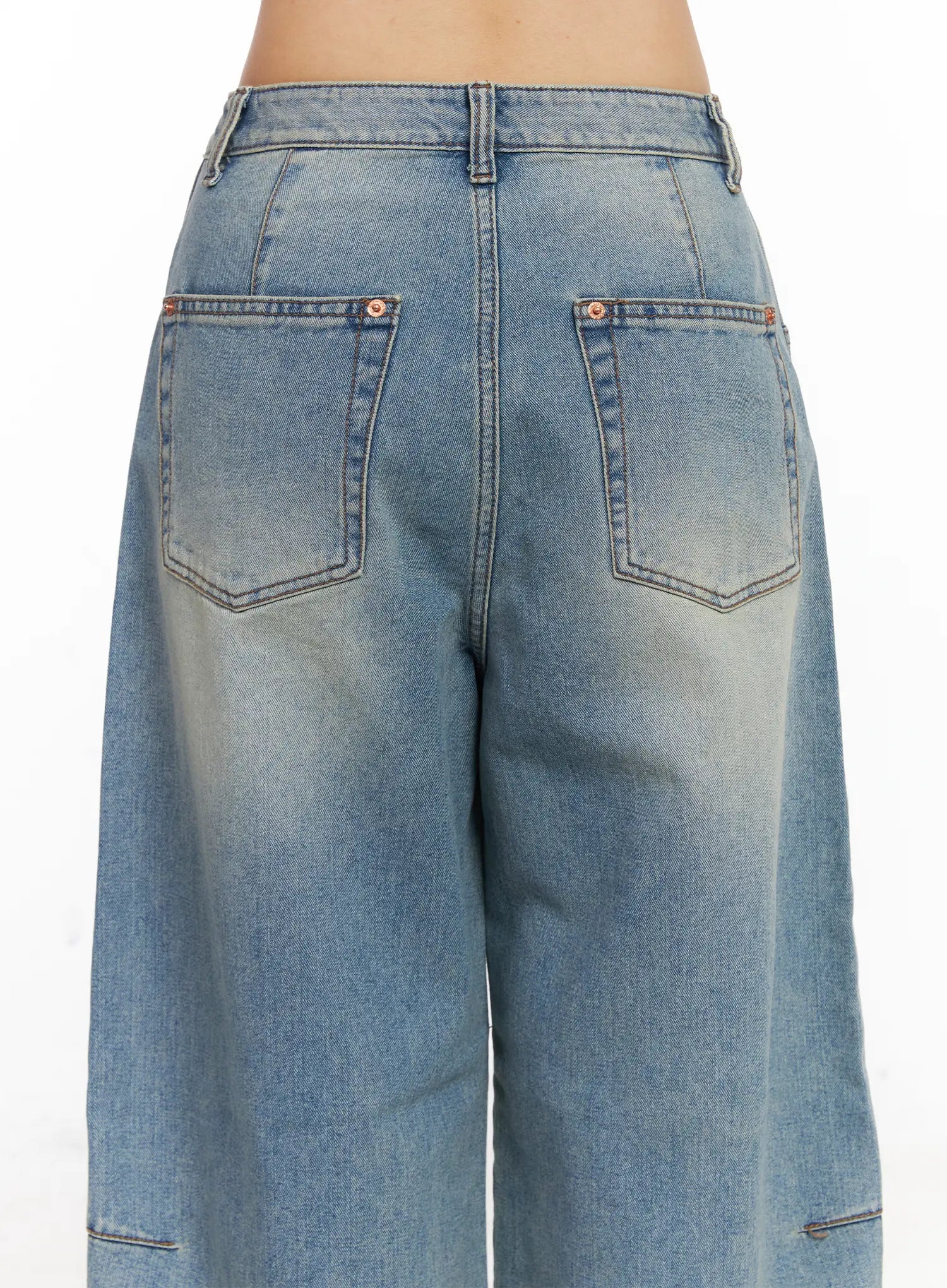 Frey Washed Wide-Leg Jeans CJ523 in light blue, back close-up on model, showing dual patch back pockets with copper rivets and washed denim texture detail.