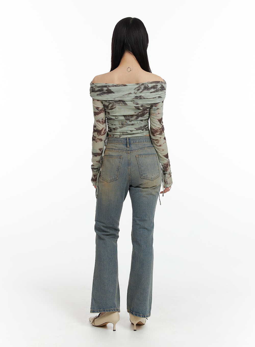 Washed Flared Jeans IF426 in blue, full-length back view on model, slim bootcut silhouette with washed indigo finish, styled with printed off-shoulder mesh top.