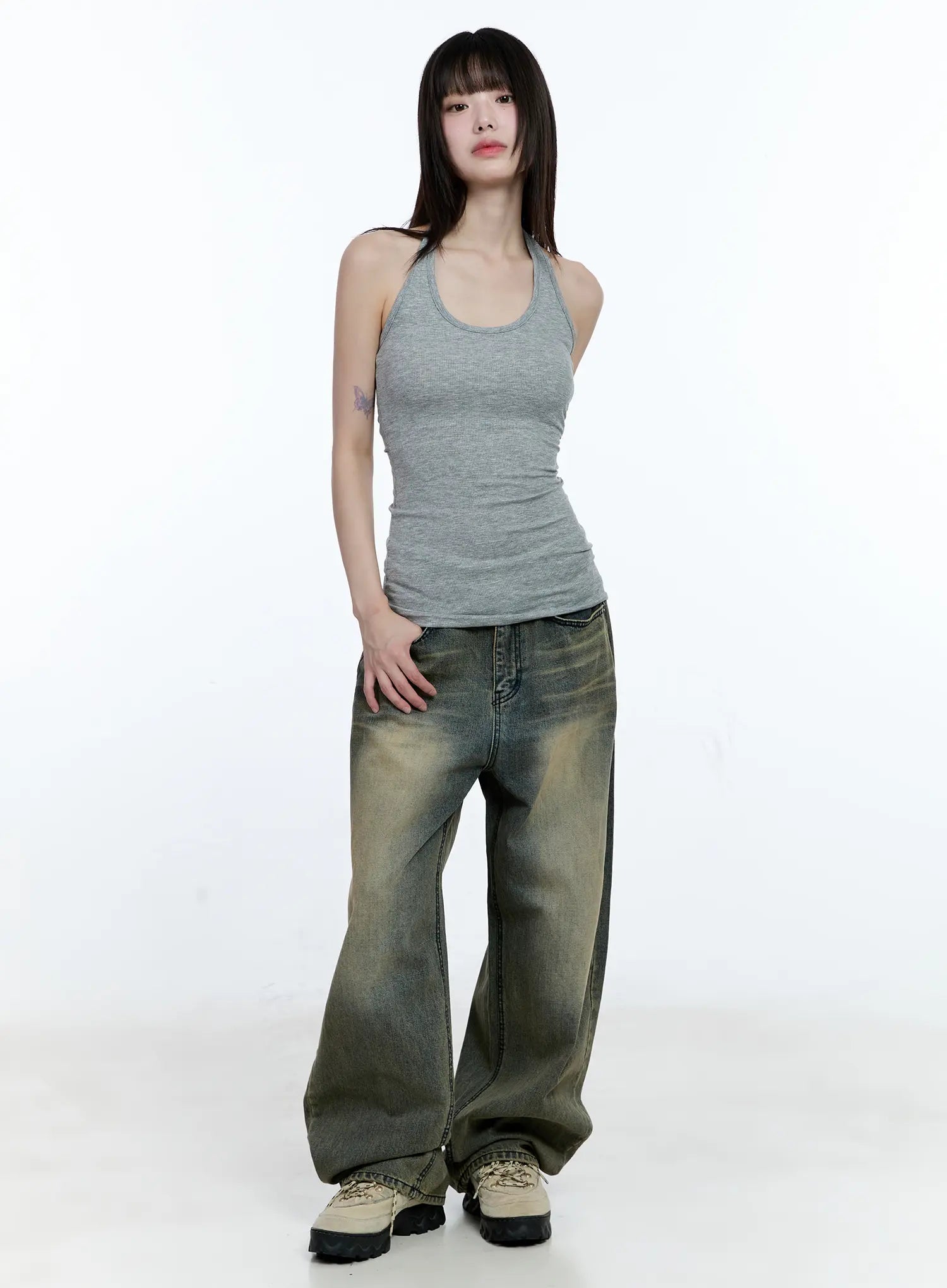 Yeonsoo Vintage-Wash Wide-Leg Jeans CG507 in vintage blue, full-body front view on model, wide-leg hem pooling over chunky sneakers, paired with grey ribbed halter tank.
