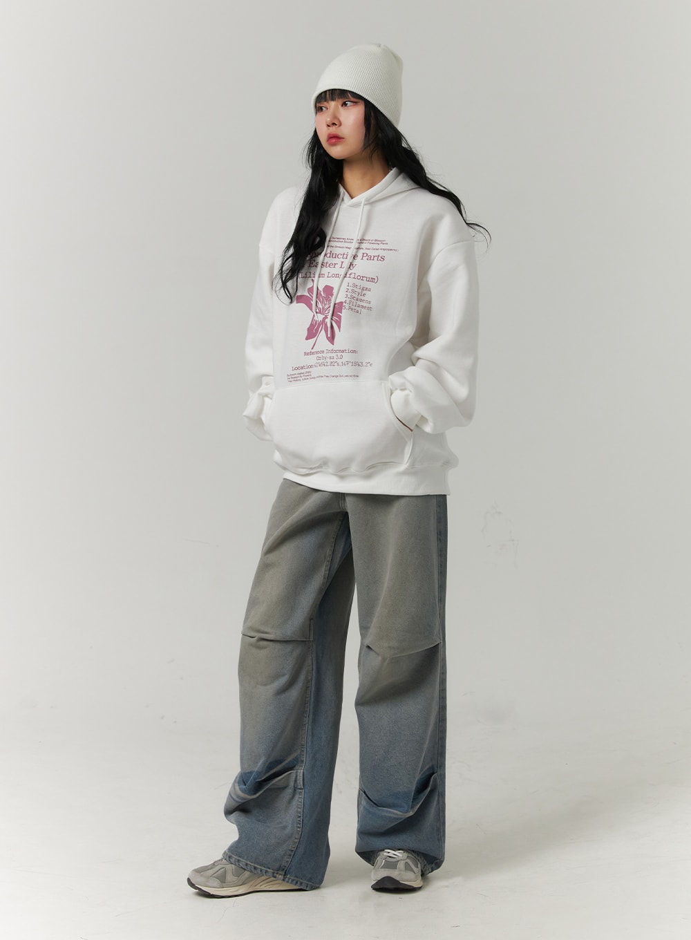 Pintuck Washed Denim Wide-Leg Jeans CJ418 in blue, three-quarter front view on model, relaxed wide fit with pintuck detail mid-leg, washed cotton denim, paired with oversized hoodie and beanie.
