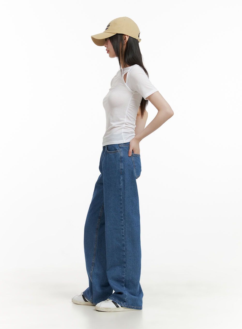 Blue Straight Leg Jeans CY428 in blue, full-body side shot on model, wide-fit washed denim showing relaxed wide leg silhouette, paired with white cut-out tee and cap.