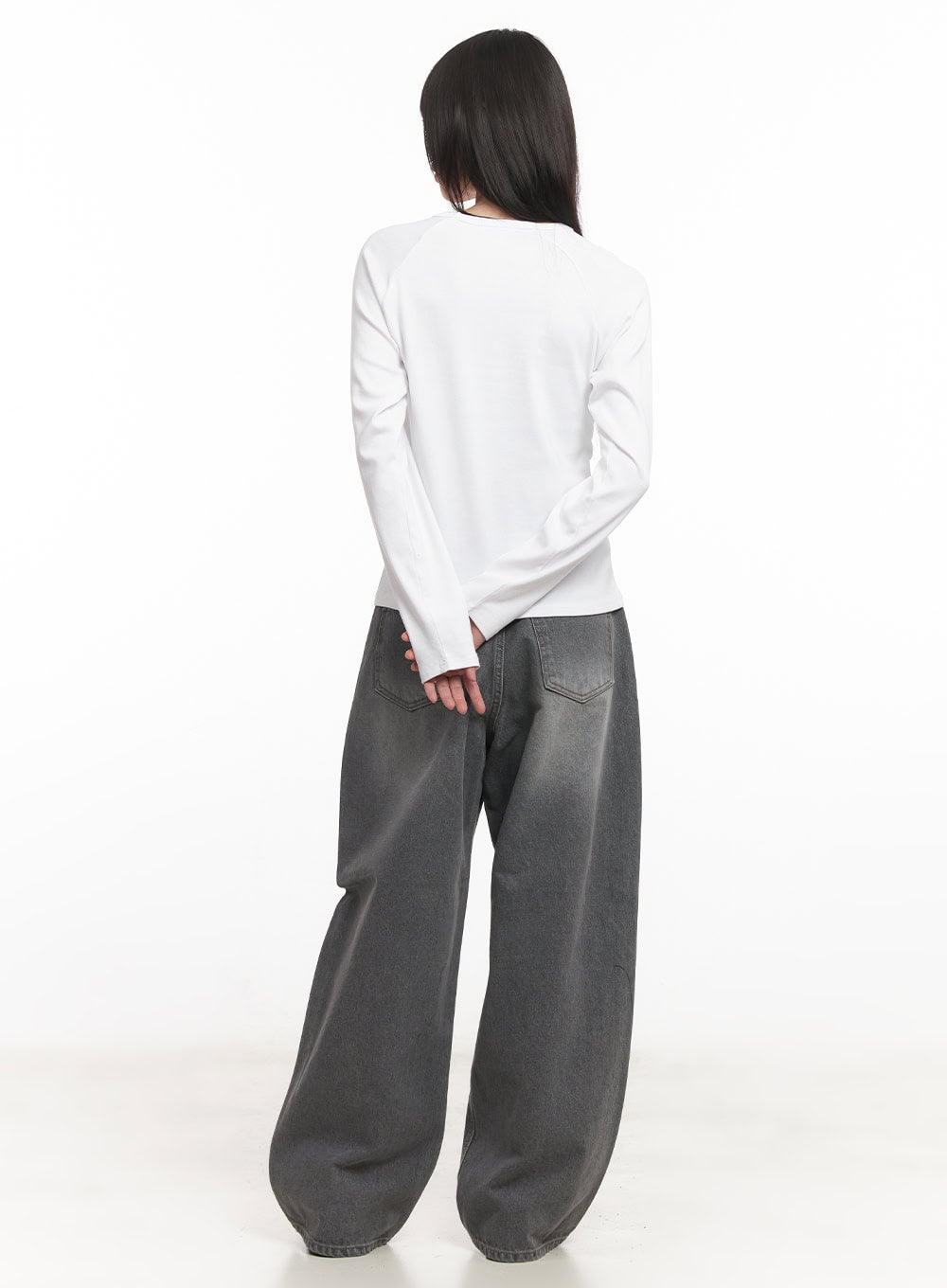 Venessa Washed Baggy Jeans CM528 in dark gray, back full-length view on model, back pockets and voluminous wide leg visible, paired with white long-sleeve top.