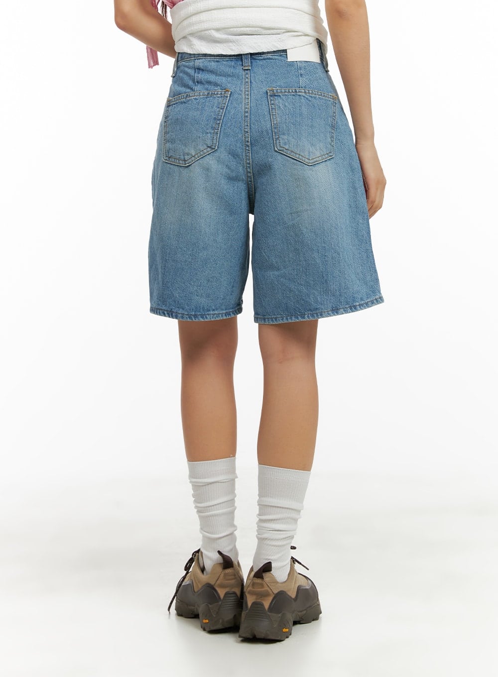 Washed Wide Leg Jorts CA409 in blue, full back view on model, wide-leg knee-length jorts, dual back pockets, faded wash, paired with white top and sneakers.