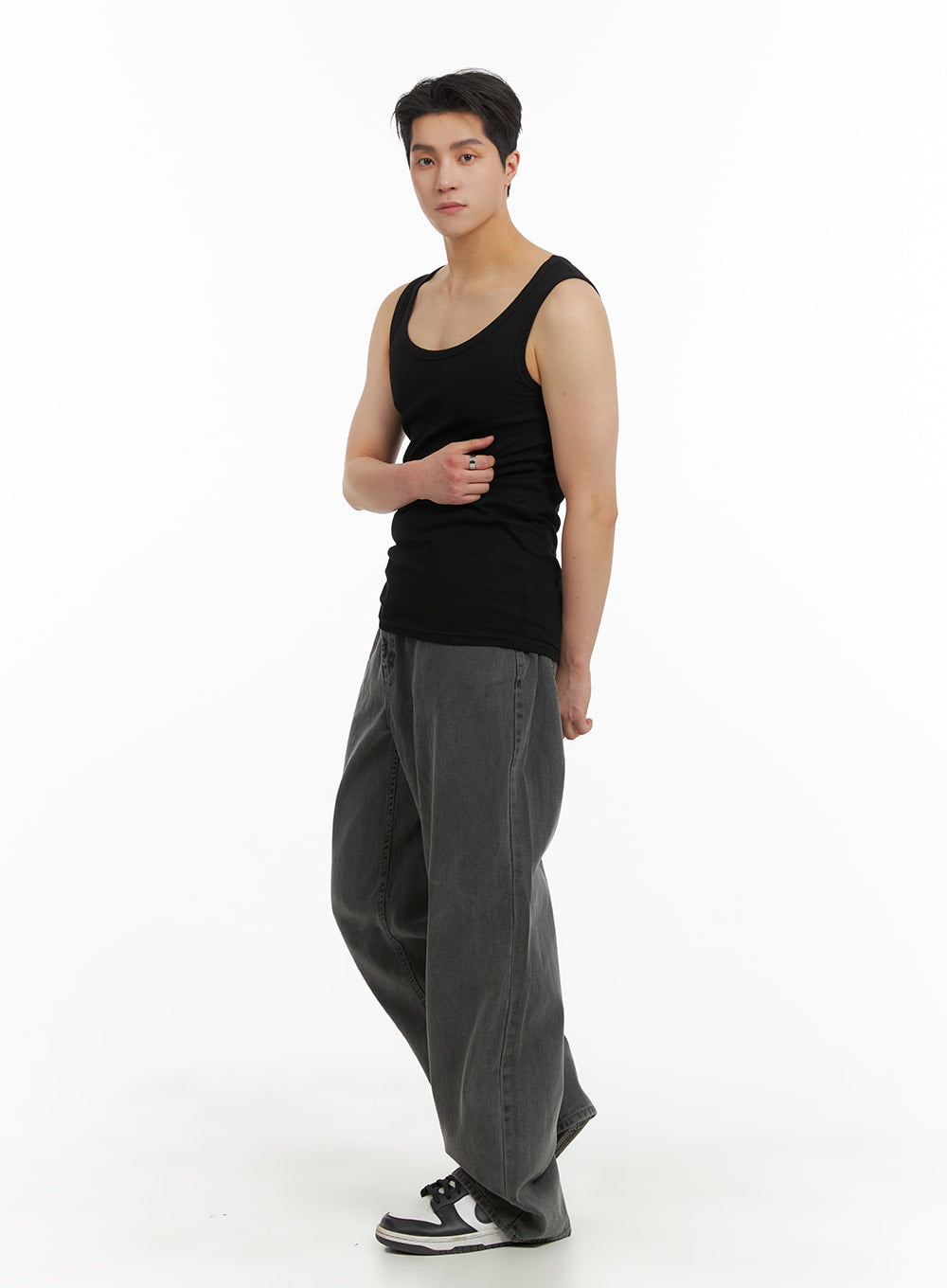 Men's Classic Baggy Fit Jeans IA401 in washed grey, front three-quarter shot on model in black tank top, full-length view of wide-leg regular-length silhouette, sneakers.