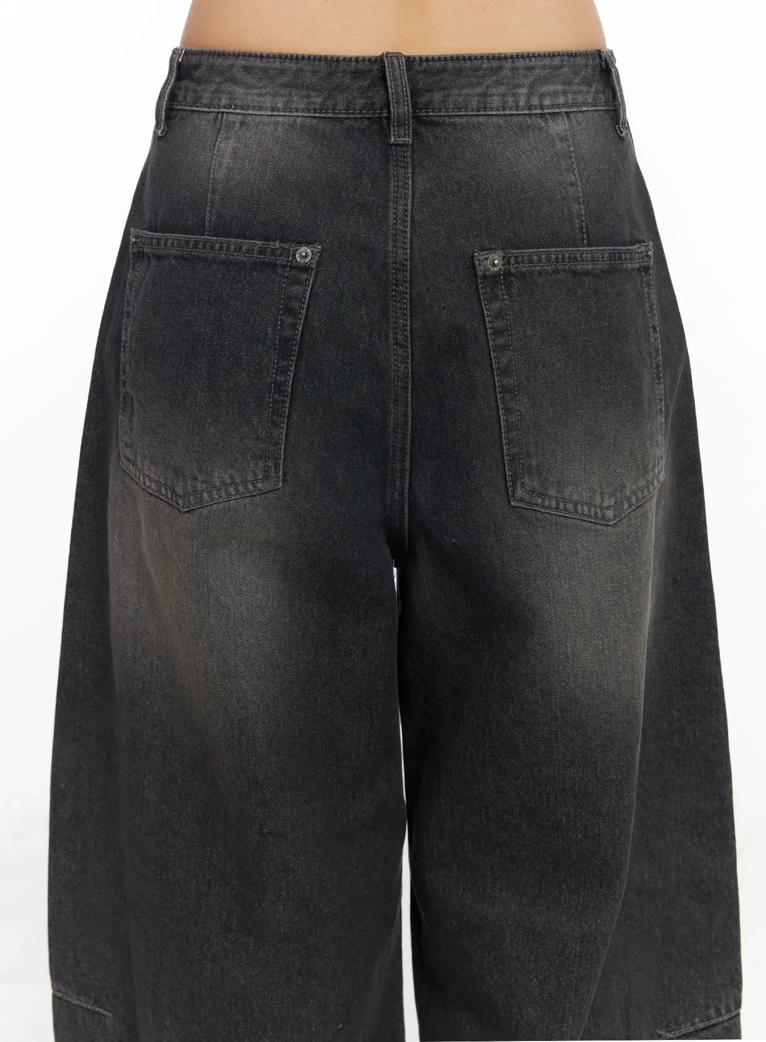 Nayeli Baggy Jeans CJ522 in dark gray, close-up back waist detail on model, showing two large patch pockets, belt loops, and washed fading on cotton denim.