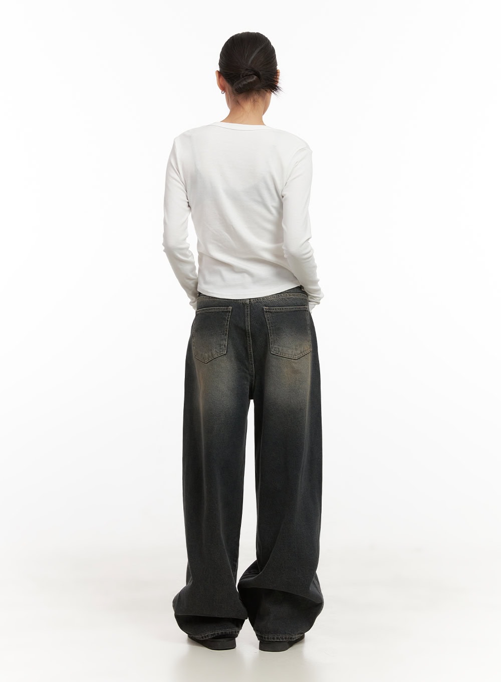 Matilda Washed Denim String Baggy Jeans CD410 in black, full-body back on model, extremely wide baggy legs with floor-pooling hem, washed denim, paired with white long-sleeve top and shearling slides.
