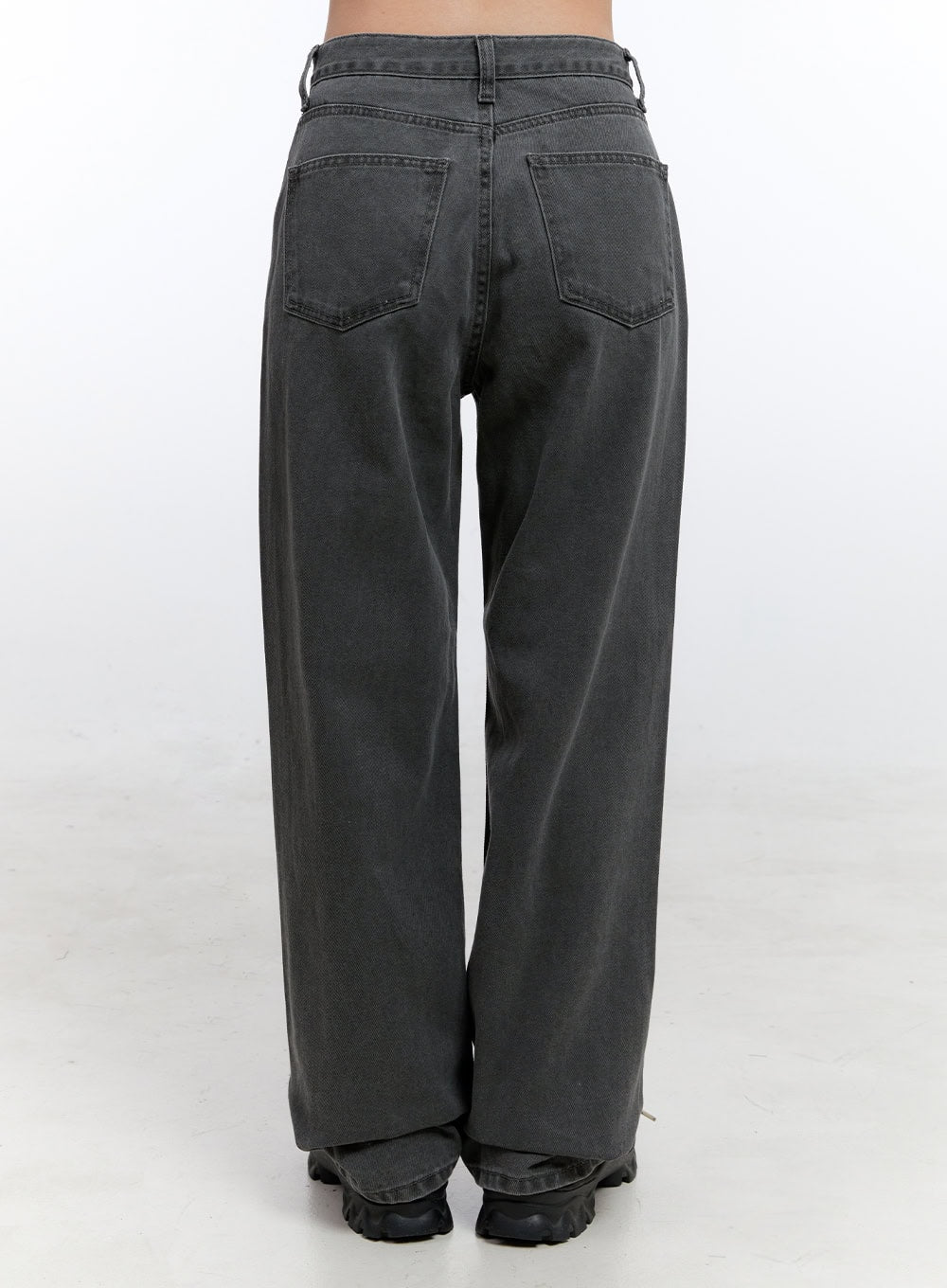 Chloe Wide-Leg Comfy Jeans ON418 in gray, back crop view on model, washed cotton wide-leg showing dual back pockets and belt loops, hem pooling over chunky sneakers.
