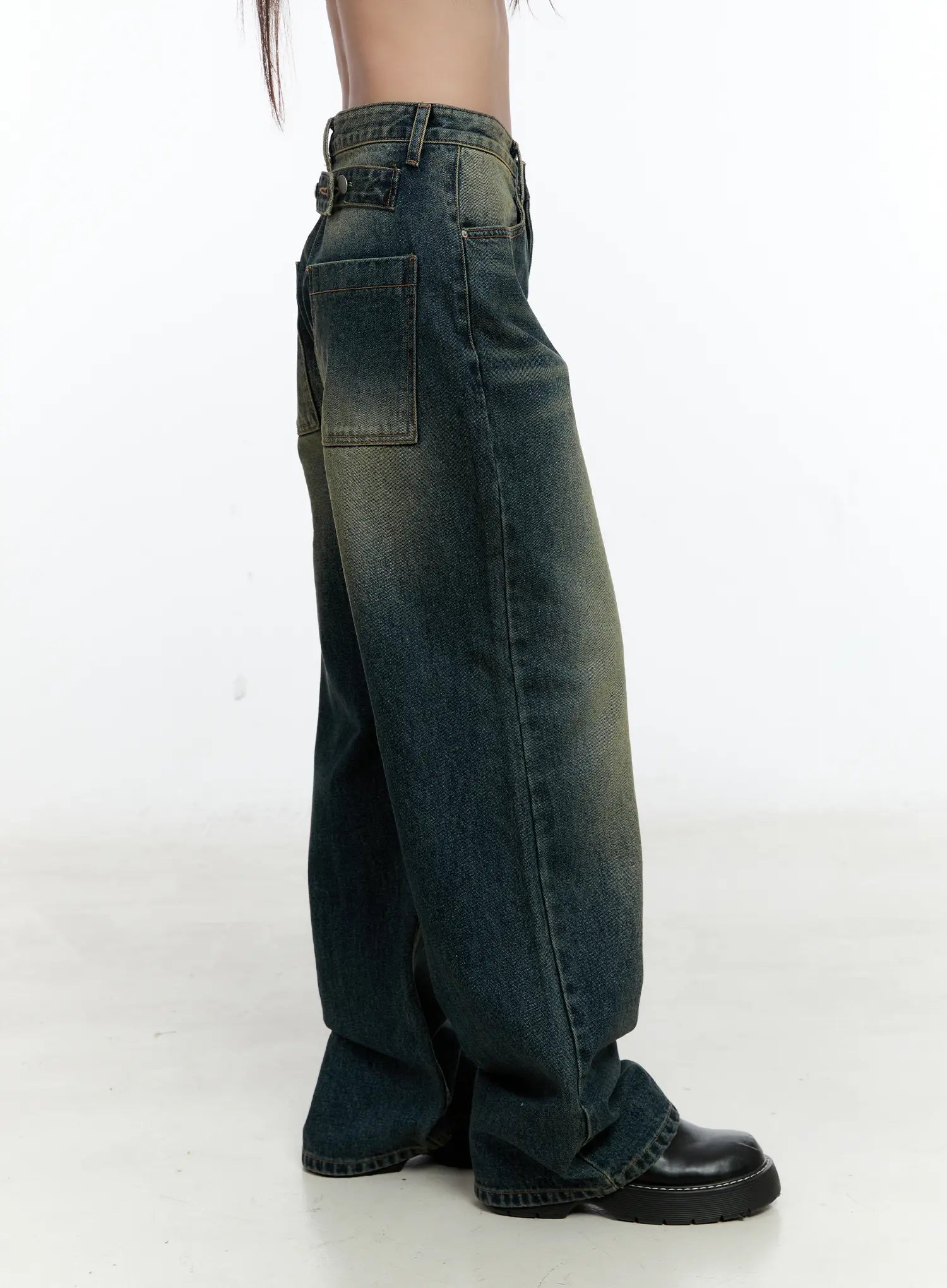 Lilian Vintage Wash Wide-Leg Jeans CS518 in vintage blue-green, side close-up on model showing back patch pocket, belt loops, faded wash gradient, and wide-leg hem.