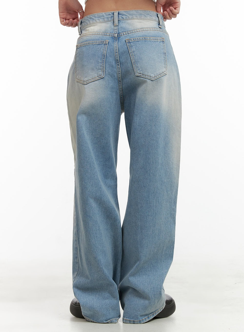 Urban Washed Ripped Baggy Jeans CU405 in Blue, back view waist-to-hem close-up on model, showing two back patch pockets, washed fading, and full wide-leg drape in cotton denim.