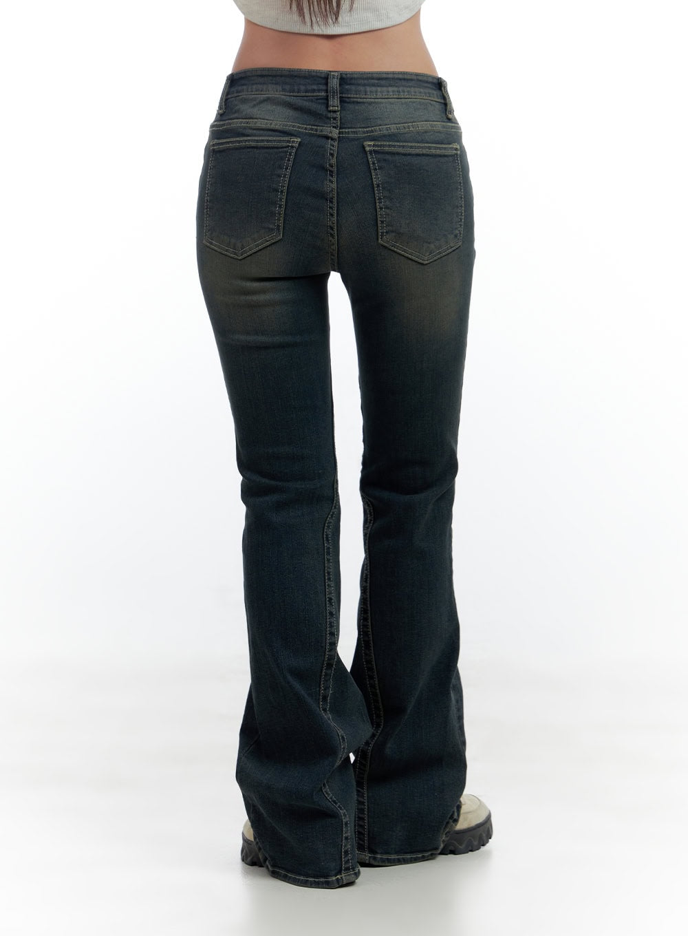 Aspen SlimFit Washed Bootcut Denim Jeans CS424 in dark blue, back crop shot on model, close view of dual back pockets with washed denim texture, contrast topstitching, and bootcut flare leg.