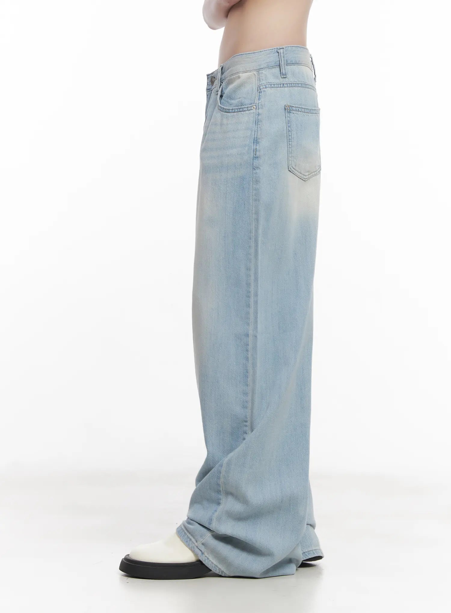Garam Washed Wide-Leg Jeans CU518 in light blue, side detail shot on model, back pocket and wide leg silhouette visible, light washed fade along inseam, floor-length hem.