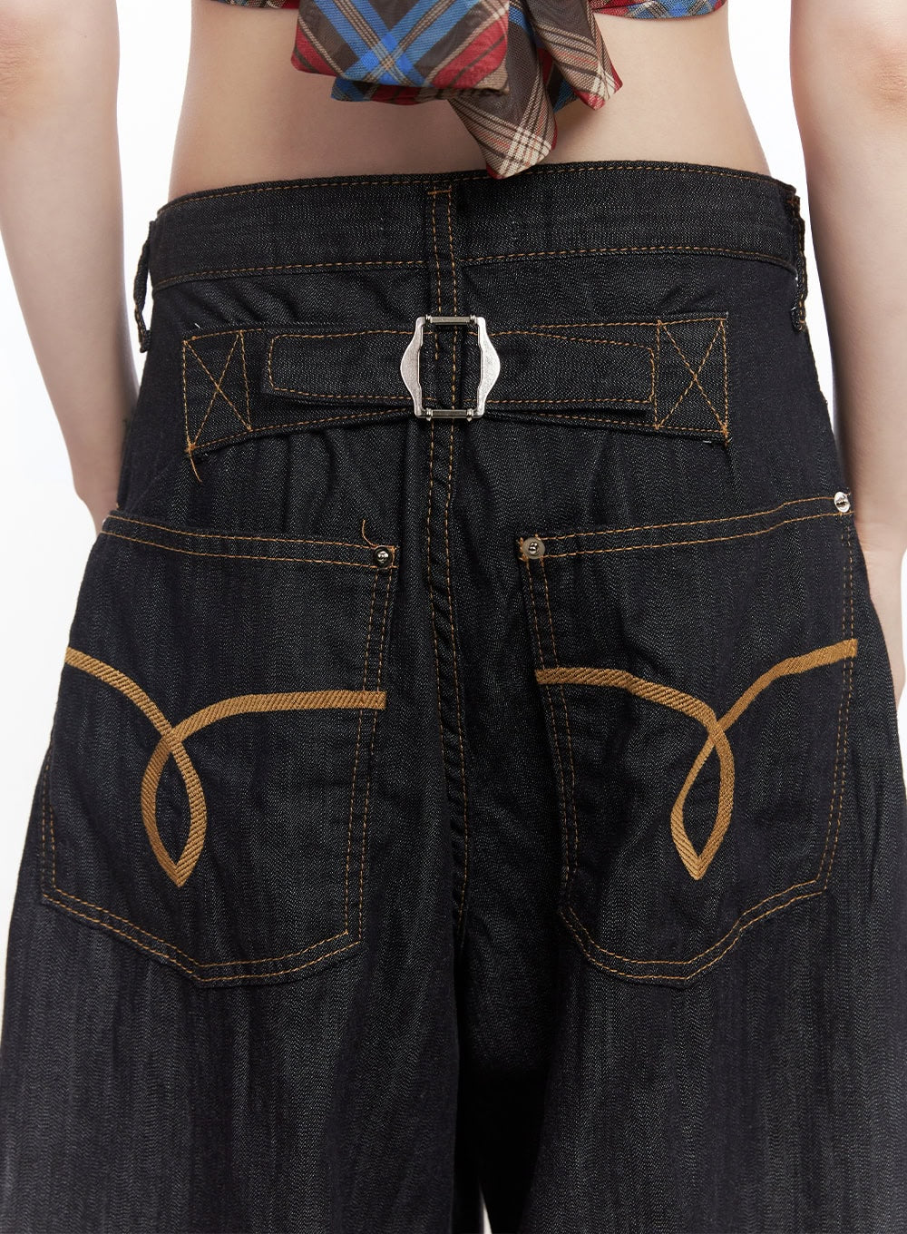 Jessie Stitched Wide-Leg Jeans CY520 in dark blue, back waistband close-up showing silver buckle hardware, X-stitch detail, and golden embroidered back pockets on dark cotton denim.