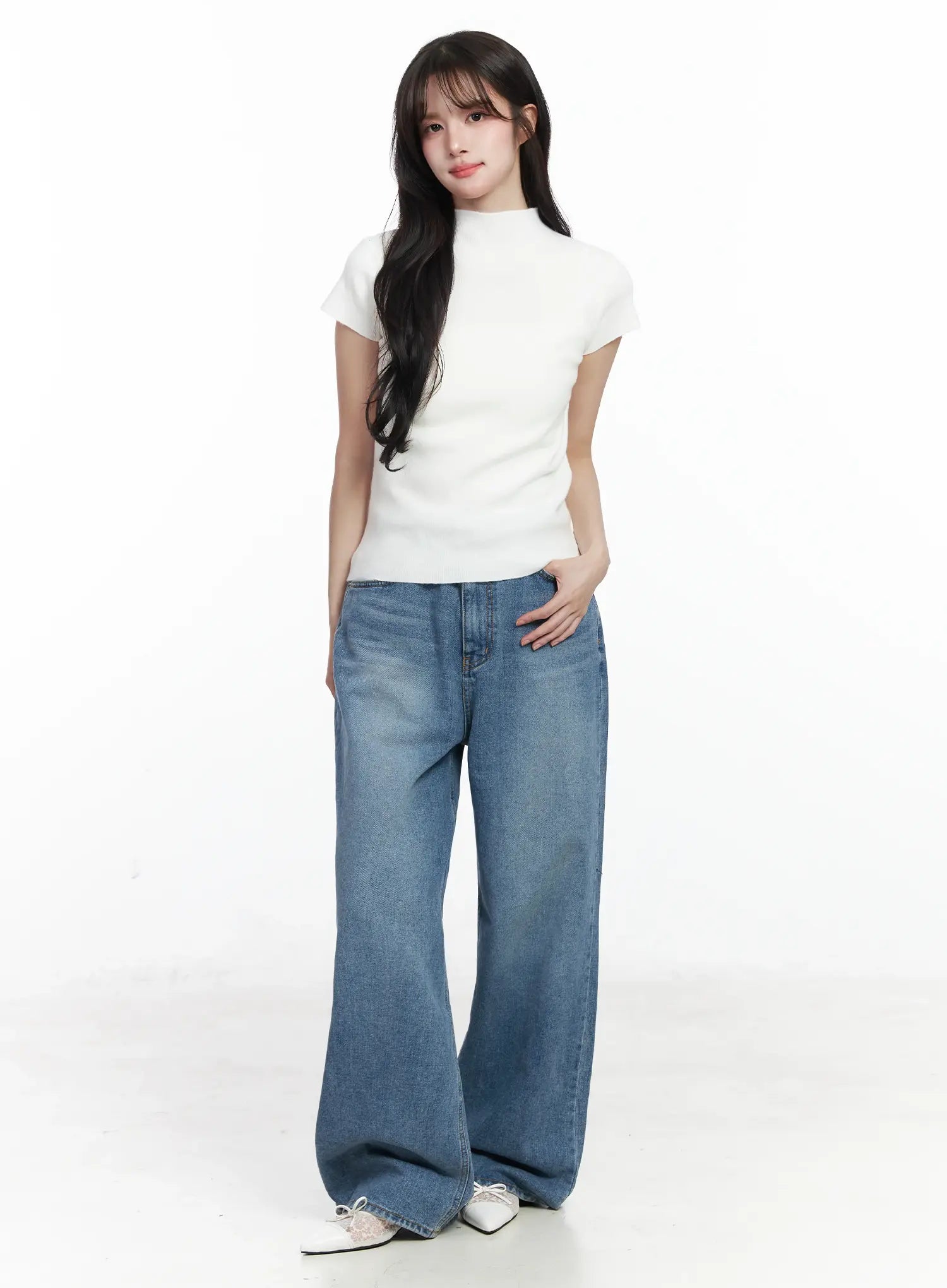Ensley Wide Leg Jeans IJ529 in blue, full-body front outfit shot on model facing forward, styled with white ribbed mock-neck top and white Mary Jane shoes.