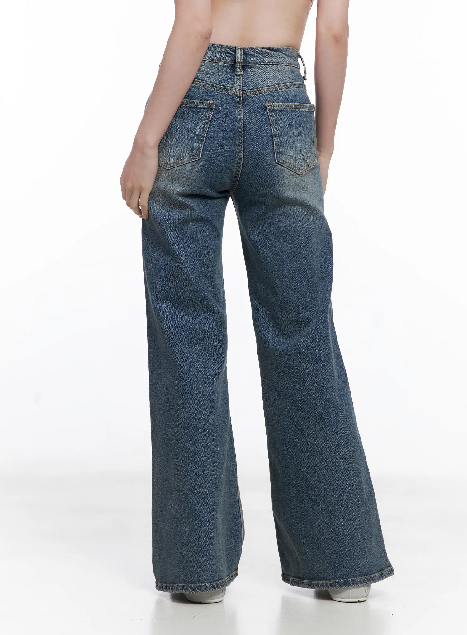 Juae High Waist Flare Jeans CG520 in blue, back view on model, showing wide flare hem, back pockets with gold stitching, washed denim finish.