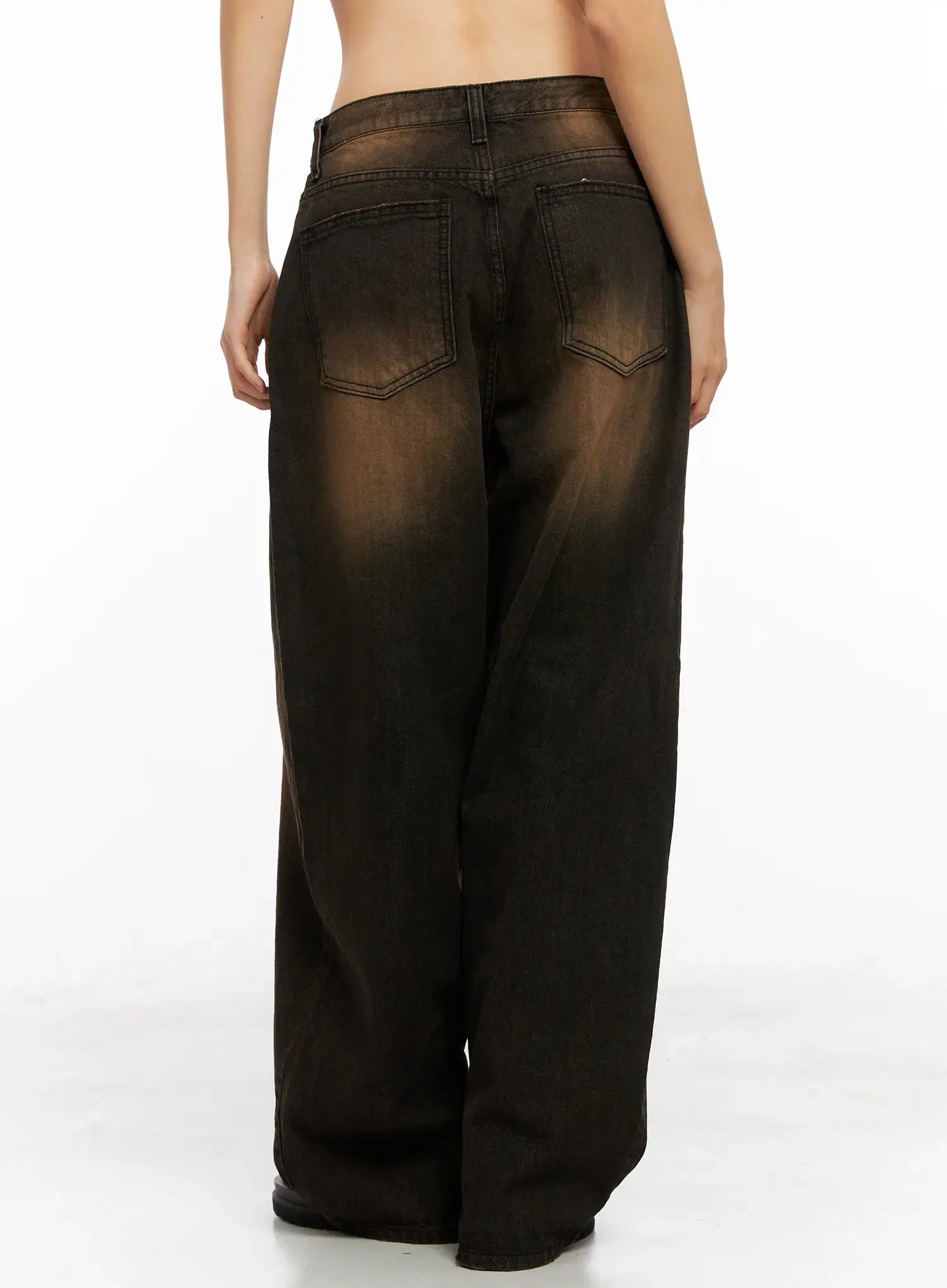 Analia Washed Wide-Leg Jeans CO529 in brown, back view on model, showing back patch pockets with stitched chevron detail and washed brown hue across wide-leg cotton denim.