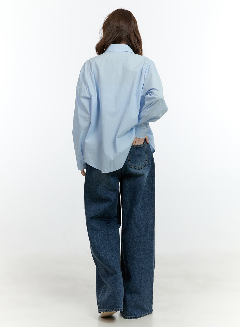 Klaudia Wide-Leg Jeans CF503 in blue, back full-length shot on model, wide-fit washed denim with dual back pockets visible, paired with light blue oversized shirt.