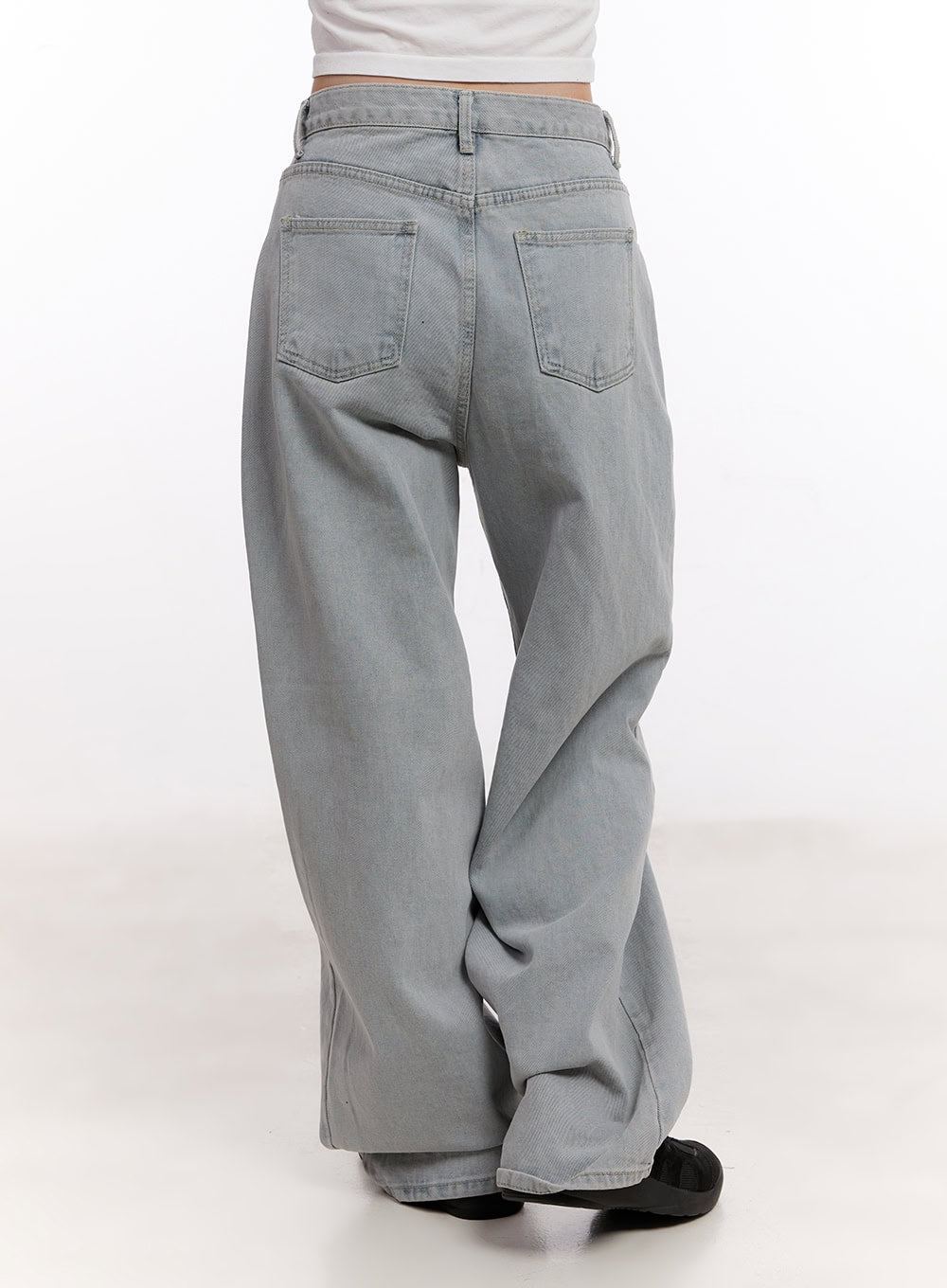 Casey Washed Baggy Wide-Leg Jeans CM526 in light gray, back product close-up on model, washed cotton denim highlighting back patch pockets, wide leg and pooling hem detail.