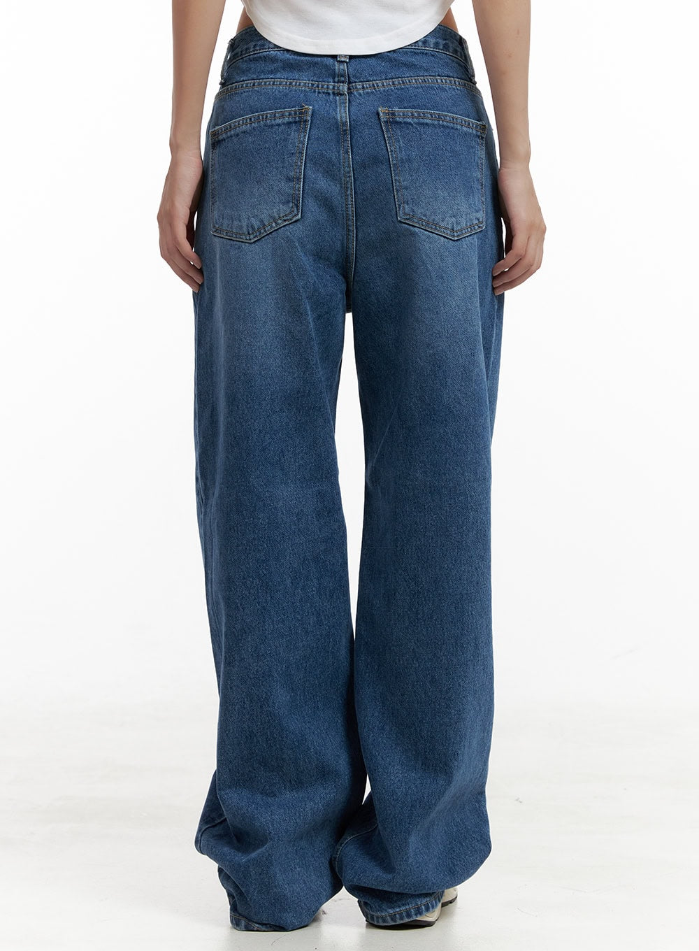 Eva Blue Washed Baggy Jeans CL431 in blue, back close-up on model from waist to hem, showing dual stitched back pockets, belt loops, and wide washed denim leg with subtle fading.