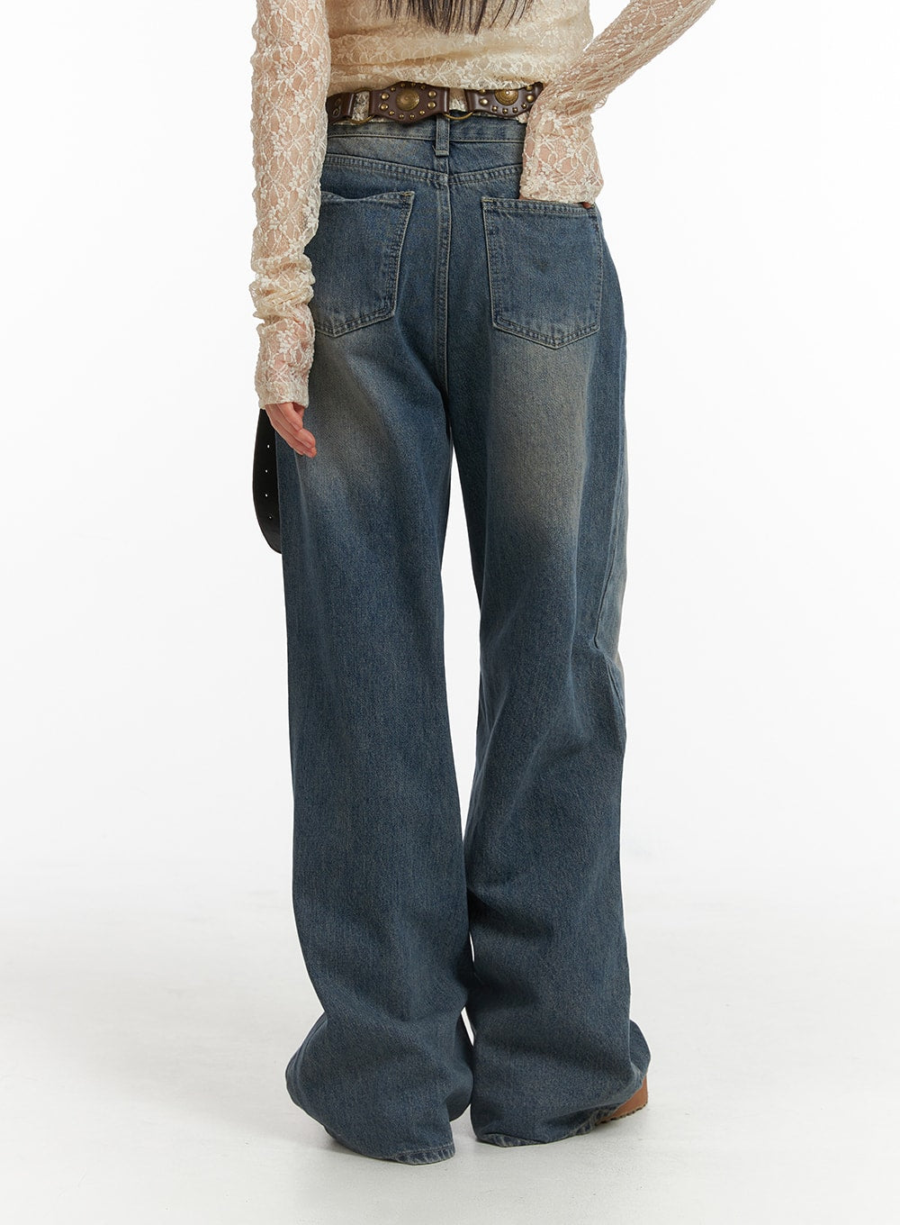 Wide Leg Denim Trousers CJ415 in washed blue, back view on model, dual back pockets with faded denim wash and wide-leg hem pooling at floor.