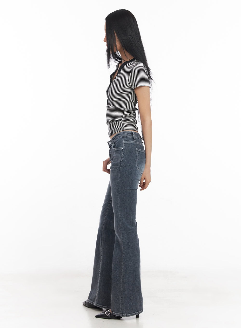 Nadeline Slim Bootcut Jeans CY528 in dark gray, full side-profile shot on model, showcasing slim leg line and bootcut flare silhouette with washed denim texture, paired with striped crop top.