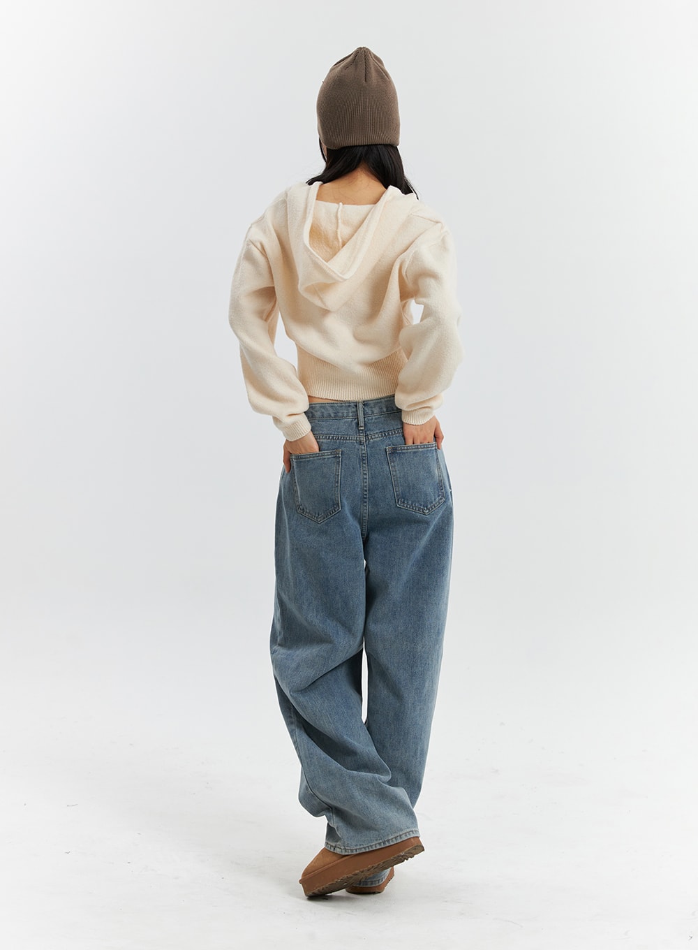 Mid Waist Washed Button Wide Leg Jeans OD320 in blue, full-body back view on model walking away, back pockets and relaxed wide-leg silhouette visible, styled with cream hoodie knit.