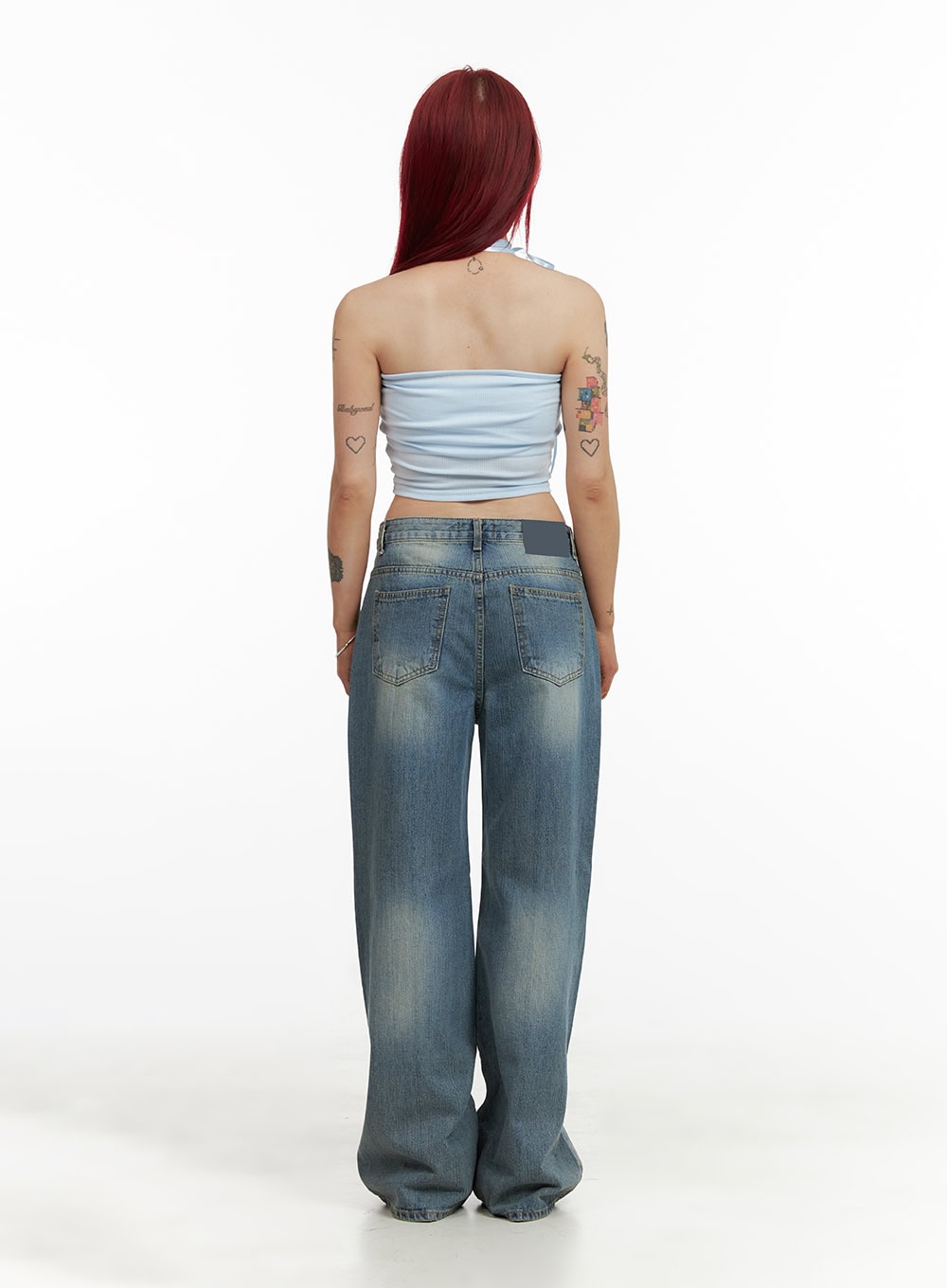 Wide Washed Denim Jeans CY429 in blue, full back view on model, wide-leg washed denim with back pockets, paired with light blue halter crop top, extra-long hem pooling at floor.