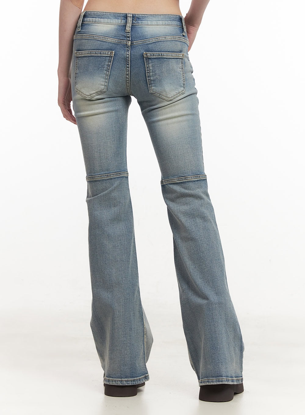 Tracy Washed Bootcut Jeans CF513 in light blue, back view on model, showing square patch pockets, washed fading, horizontal knee seam panels, and flared bootcut hem.