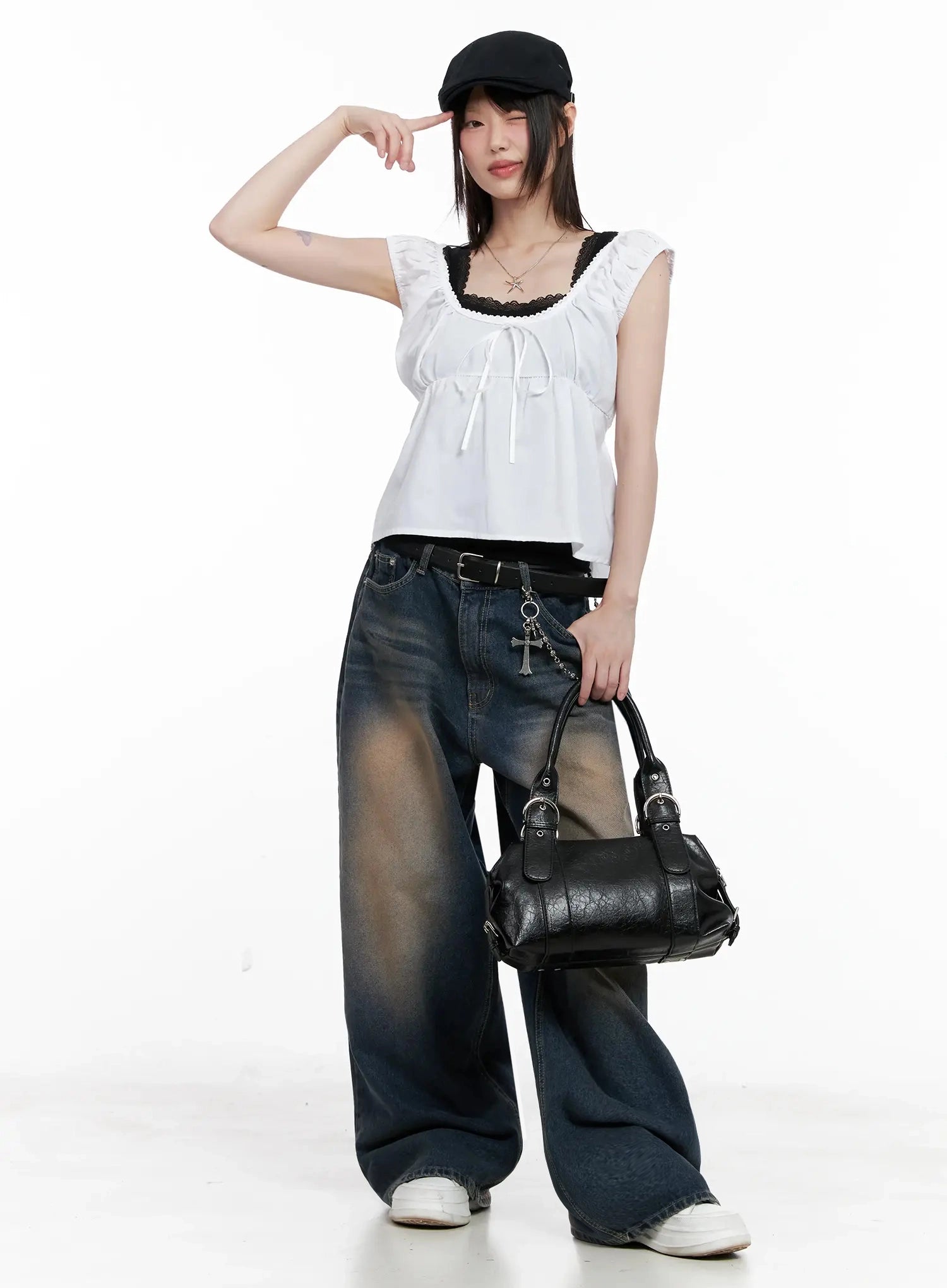 Solji Acid Washed Wide-Leg Jeans IL531 in dark blue, full-body styled shot on model with black cap and leather shoulder bag, casual Y2K outfit, strong amber wash contrast.