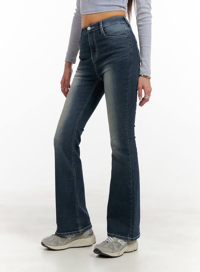 Washed Denim Slim Fit Bootcut Jeans CY402 in blue, side-angle close-up on model from waist to hem, showing slim thigh fit, bootcut flare, contrast stitching, and faded wash detail.